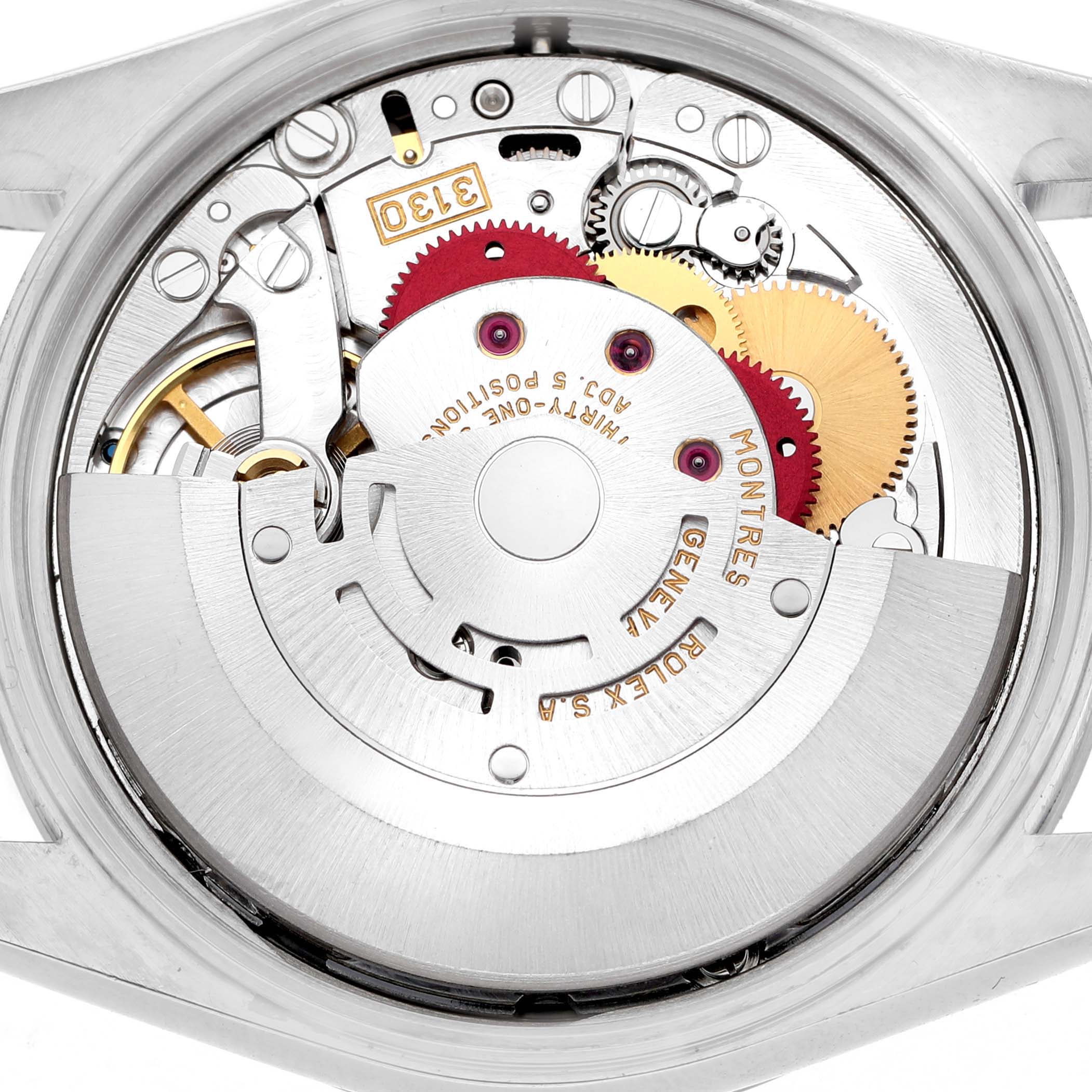 The image shows the internal movement mechanism of a Rolex Air-King 14000M Men's Stainless Steel Silver Dial watch from a top view, showcasing gears and inscriptions.
