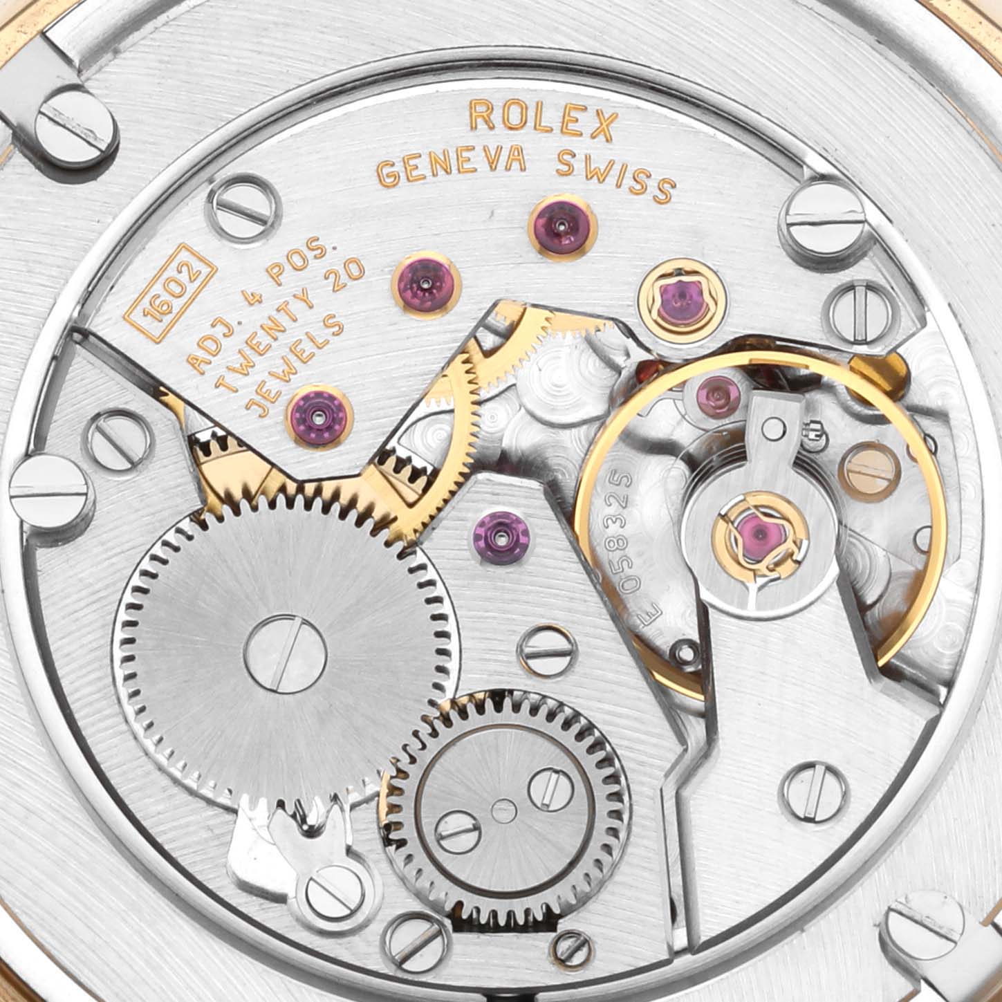 The image shows the internal movement mechanism of the Rolex Cellini 5115 Men's Yellow Gold Mother of Pearl Dial 5115 Men's Yellow Gold Mother of Pearl Dial watch, featuring gears and jewels from a close-up top view.