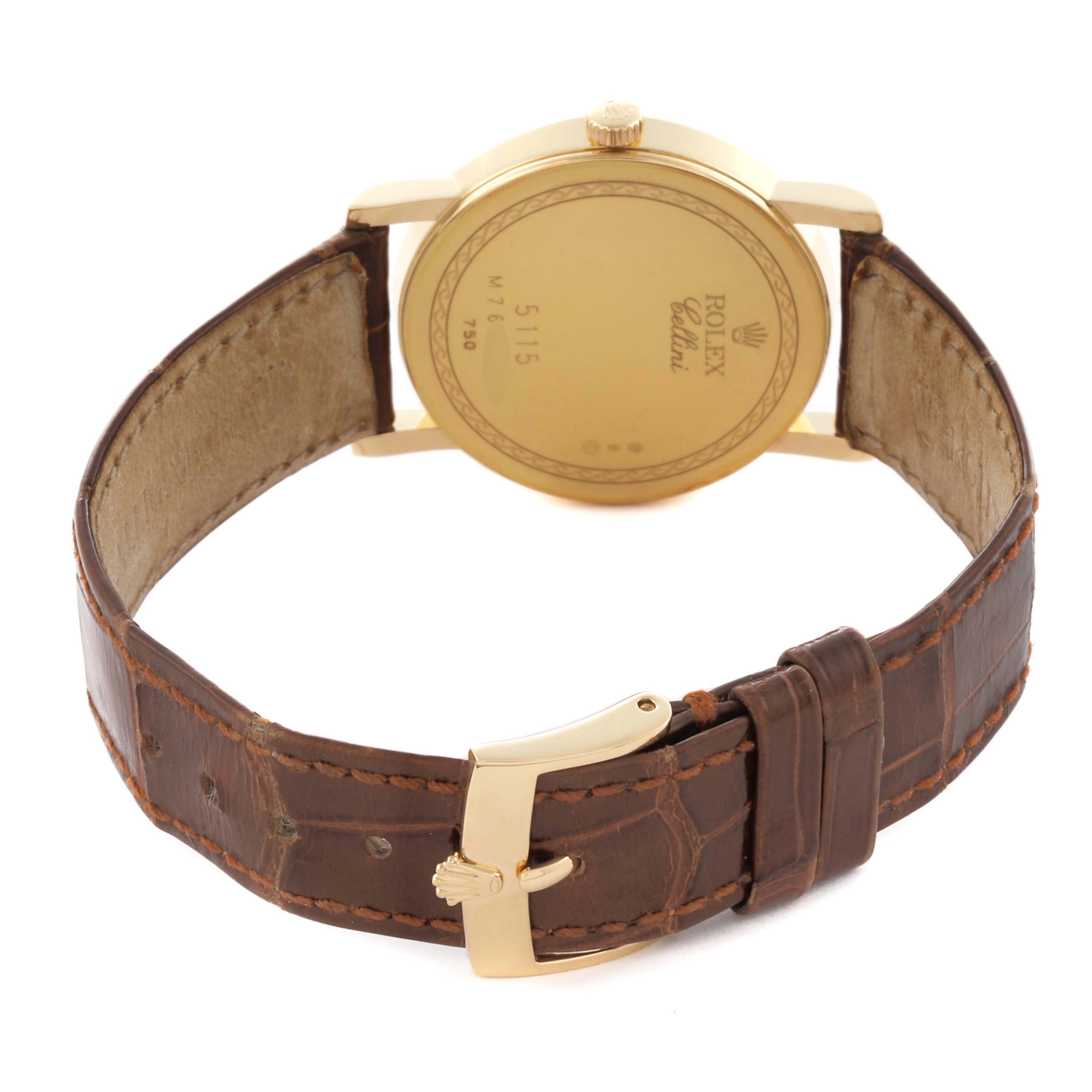 The image shows the back of a Rolex Cellini 5115 Men's Yellow Gold Mother of Pearl Dial 5115 Men's Yellow Gold Mother of Pearl Dial watch, highlighting the case back, crown, and leather strap with a buckle.