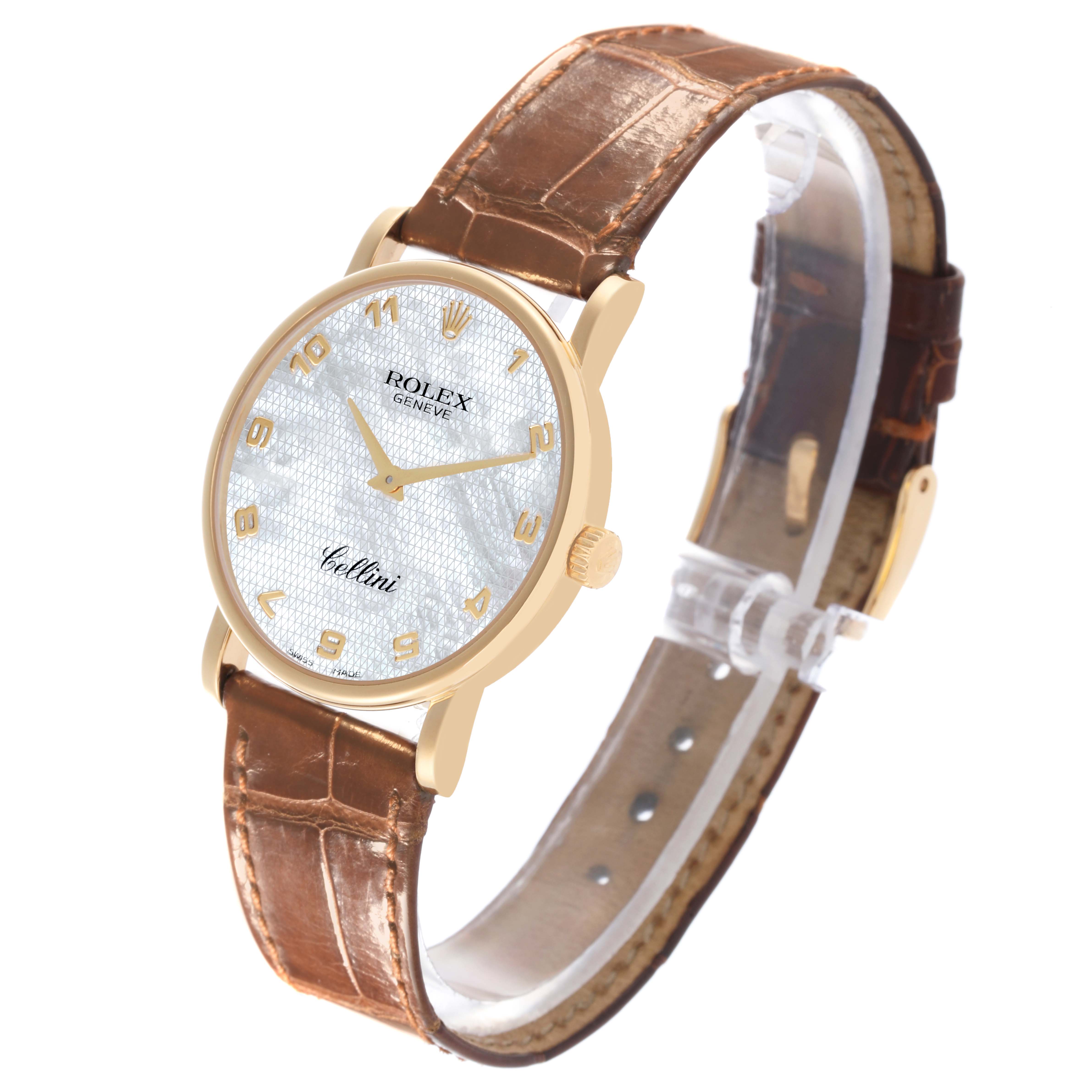 The Rolex Cellini 5115 Men's Yellow Gold Mother of Pearl Dial 5115 Men's Yellow Gold Mother of Pearl Dial watch is shown at an angle displaying the face, gold case, and brown leather strap.