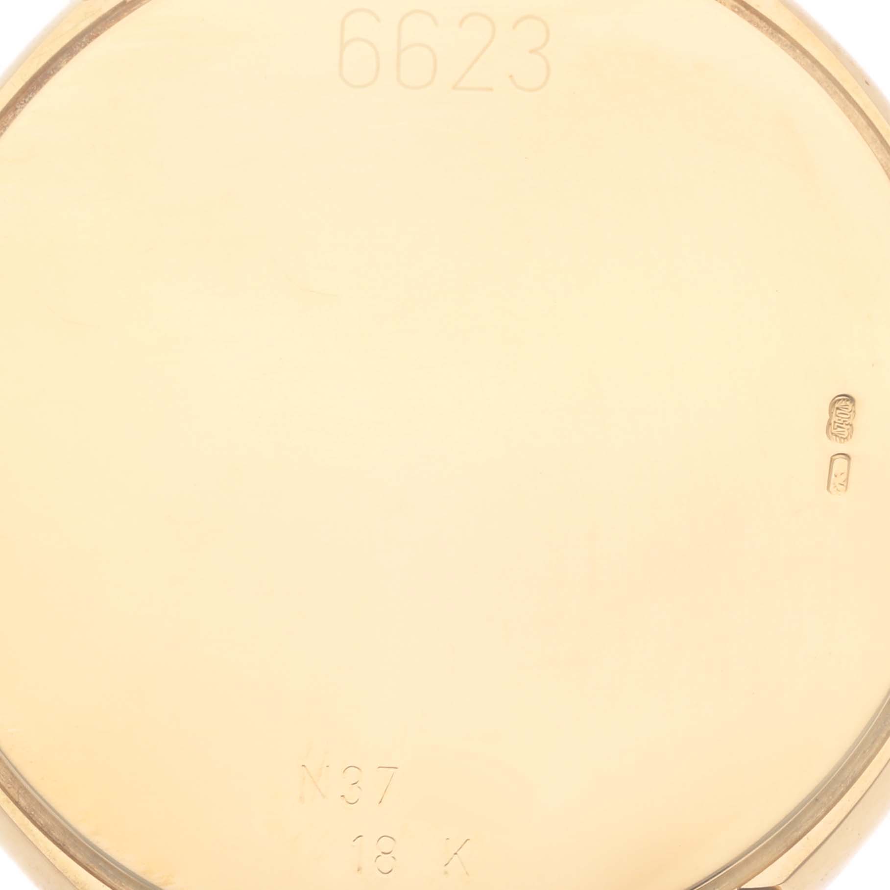 The image shows the case back interior of a Rolex Cellini 6623 Men's Yellow Gold Champagne Dial 6623 Men's Yellow Gold Champagne Dial watch, highlighting engravings and a smooth gold finish.