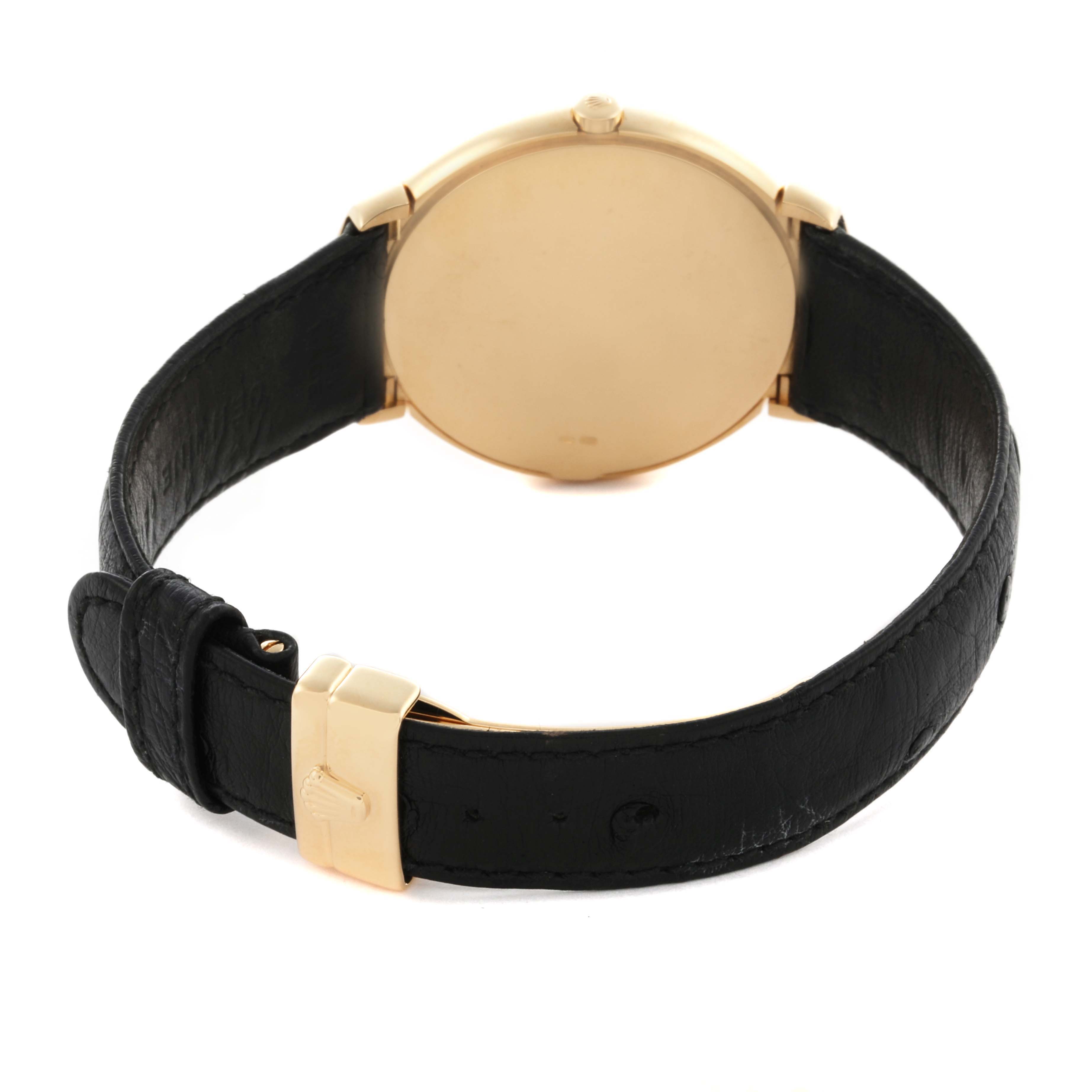 The Rolex Cellini 6623 Men's Yellow Gold Champagne Dial 6623 Men's Yellow Gold Champagne Dial watch is shown from the back, displaying the caseback, leather strap, and clasp.