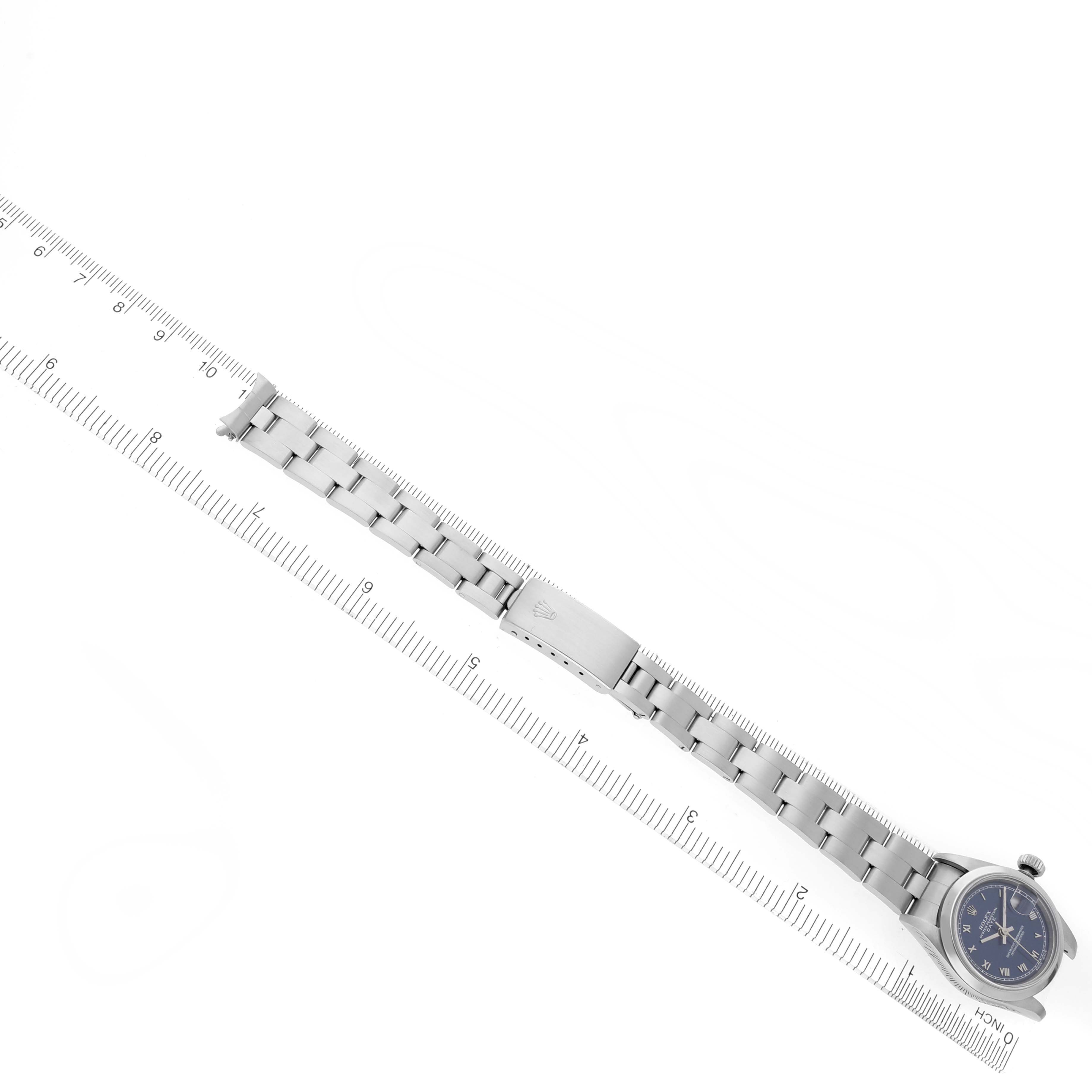 The image shows a Rolex Date 69160 Women's Stainless Steel Blue Dial 69160 Women's Stainless Steel Blue Dial watch laid flat, displaying the bracelet and clasp, aligned with a ruler for scale.