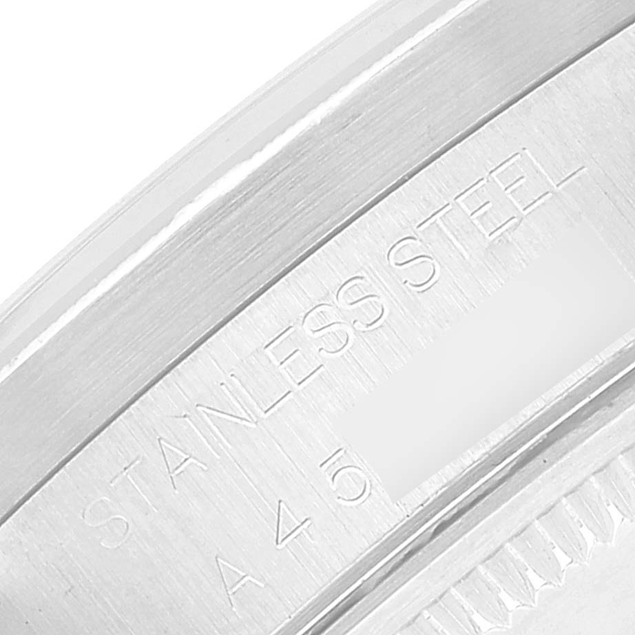 The image shows a close-up angle of the serial number and "STAINLESS STEEL" engraving on the case back of a Rolex Date 15210 Men
s Stainless Steel Silver Dial 15210 Men
s Stainless Steel Silver Dial model.