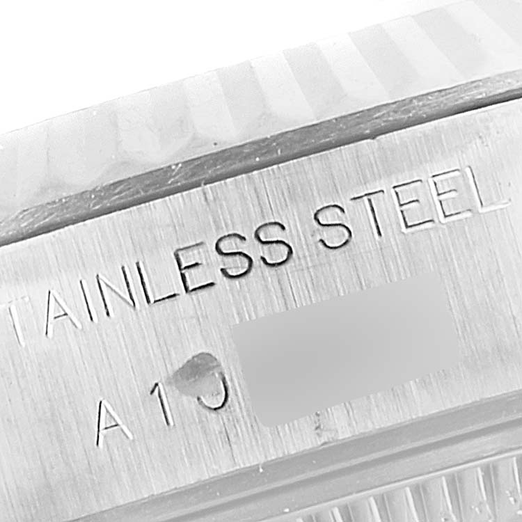 The image shows a close-up of the side engraving on a stainless steel Rolex Datejust 69174 Women's Stainless Steel Silver Dial 69174 Women's Stainless Steel Silver Dial watch.