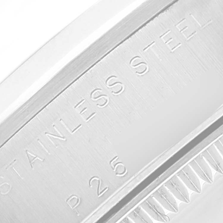 The image shows a close-up view of the case back engraving of a Mid-Size Rolex watch, highlighting the "STAINLESS STEEL" inscription.