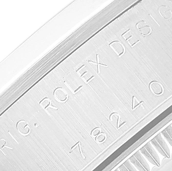 This is a close-up shot showing the engraving on the side of the watch case of a Mid-Size Rolex.