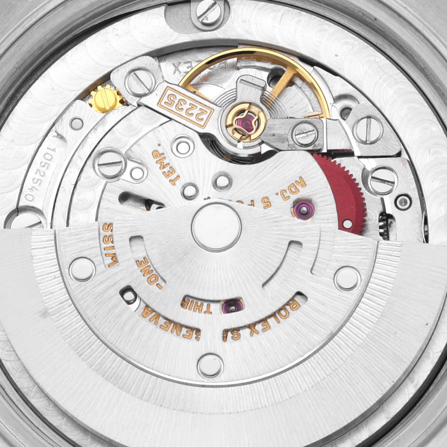 This image shows the intricate inner mechanism of a Mid-Size Rolex watch, highlighting the movement components.