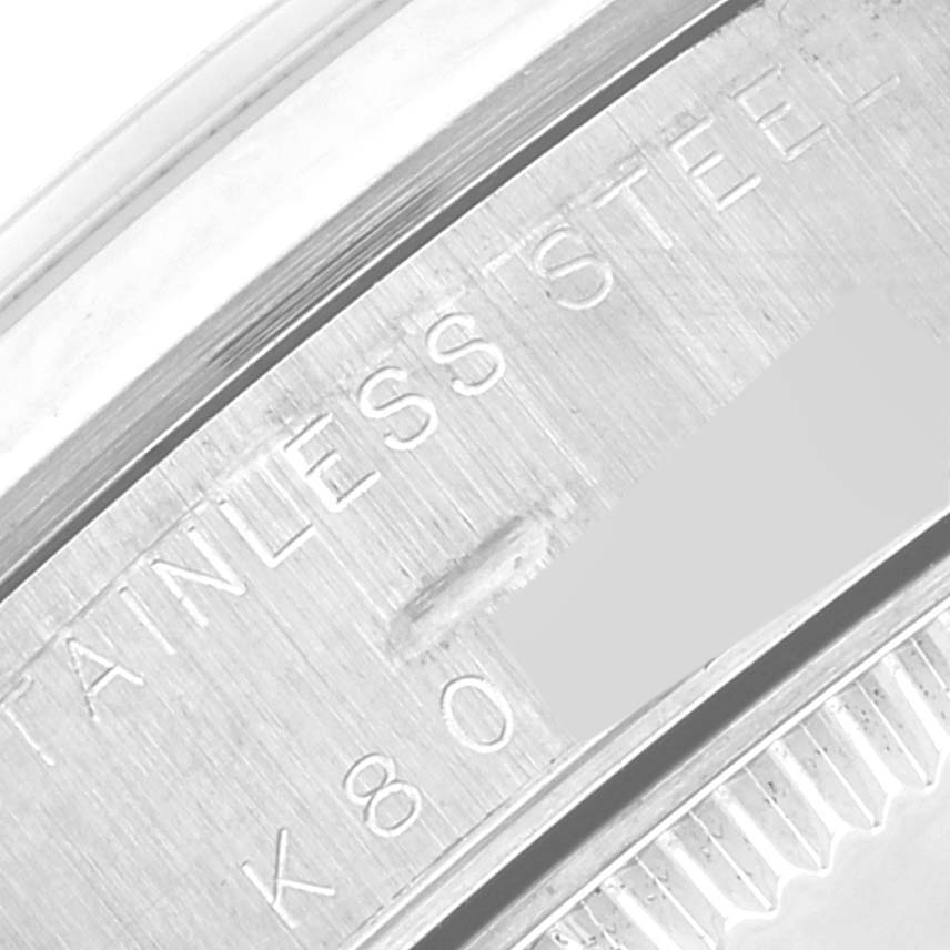 This image shows a close-up of the side engraving on a Rolex Mid-Size 78240 Women
s Stainless Steel White Dial 78240 Women
s Stainless Steel White Dial watch, highlighting the stainless steel material.
