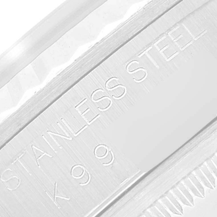 This close-up image shows the side of the bezel and stainless steel marking on a Rolex Datejust 16234 Men's Stainless Steel Silver Dial 16234 Men's Stainless Steel Silver Dial watch.