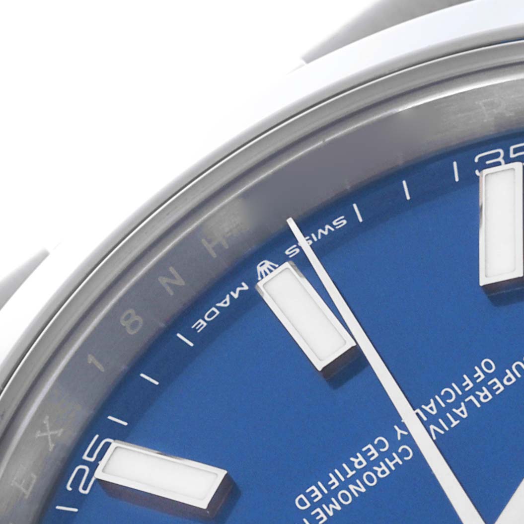 The image shows a close-up of the Rolex Datejust 41 126300 Men's Stainless Steel Blue Dial 126300 Men's Stainless Steel Blue Dial, focusing on the blue dial, hour markers, and part of the bezel.