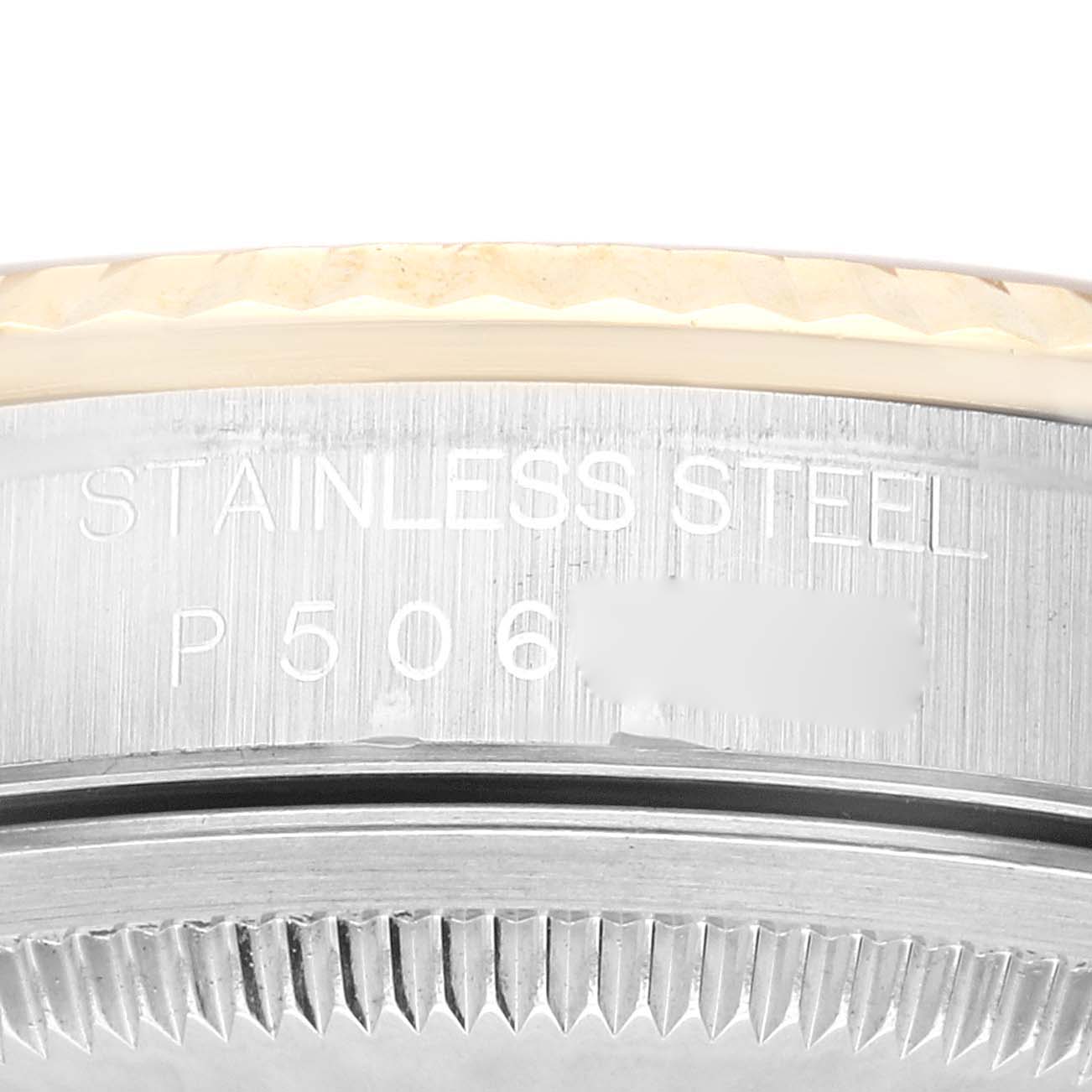 The image shows a close-up view of the bezel and side casing of a Rolex Datejust 16233 Men's Steel and Gold (two tone) Champagne Dial 16233 Men's Steel and Gold (two tone) Champagne Dial watch, displaying the serial number engraving.