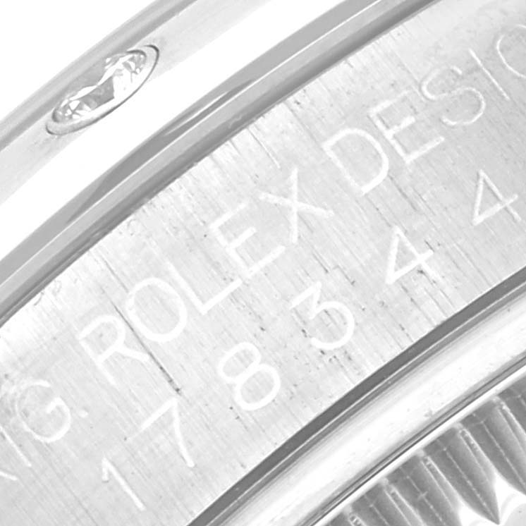 This close-up image shows the side engraving on a Rolex Mid-Size 178344 Women's Stainless Steel Mother of Pearl Dial 178344 Women's Stainless Steel Mother of Pearl Dial watch case.