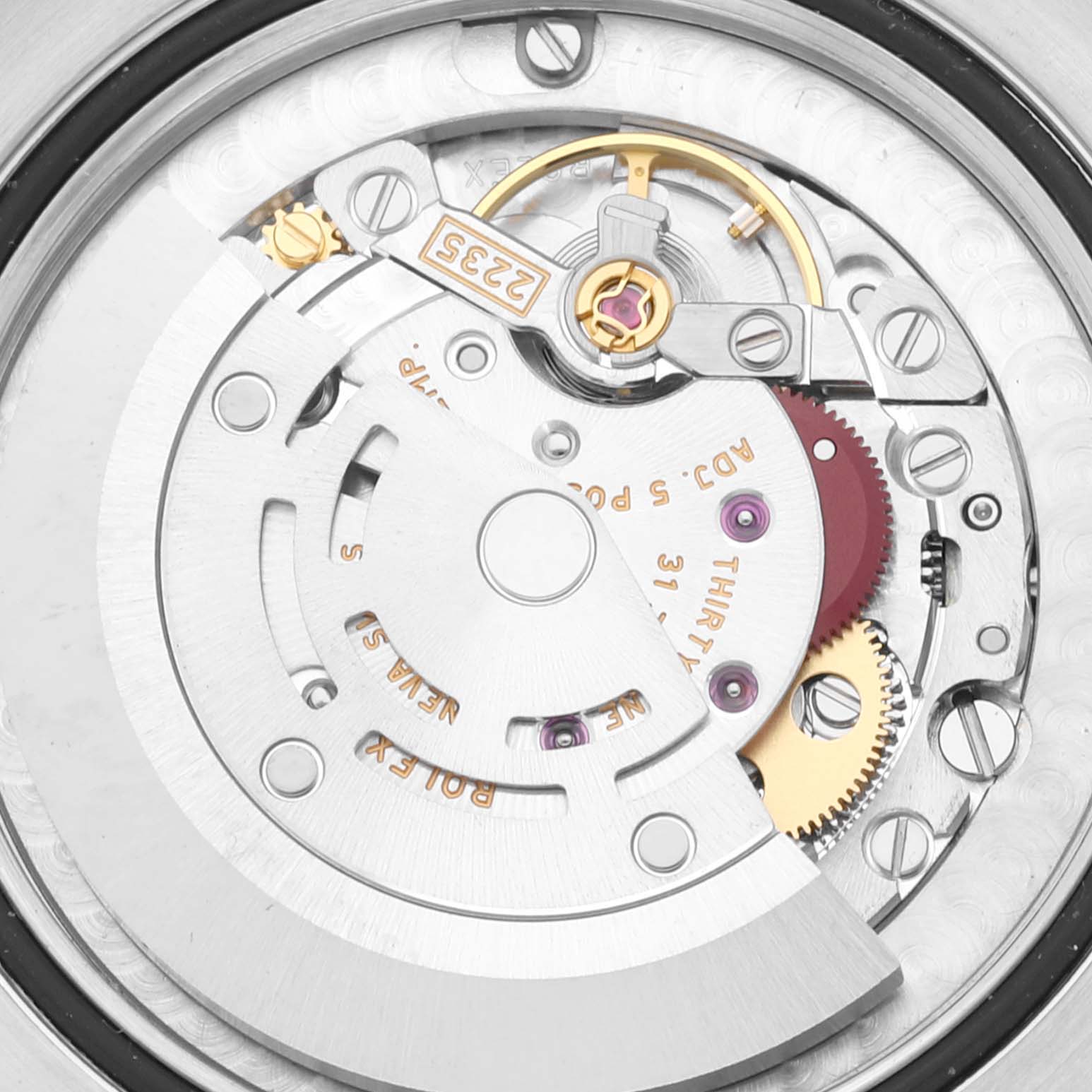This image shows the internal mechanism and movement parts of a Mid-Size Rolex watch from an overhead angle.