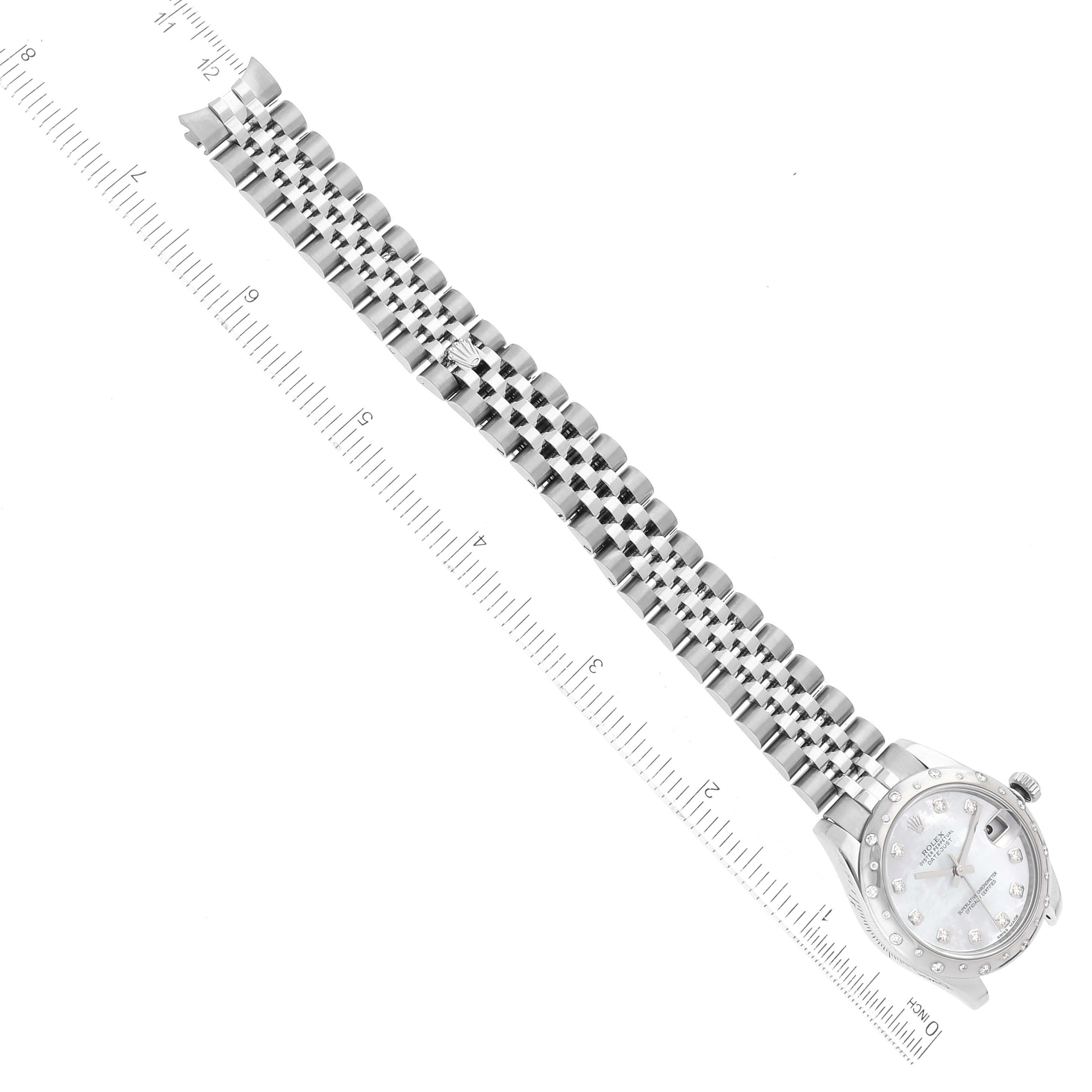 The image shows a Rolex Mid-Size 178344 Women's Stainless Steel Mother of Pearl Dial 178344 Women's Stainless Steel Mother of Pearl Dial watch viewed from above, displaying the watch face and bracelet alongside a ruler.