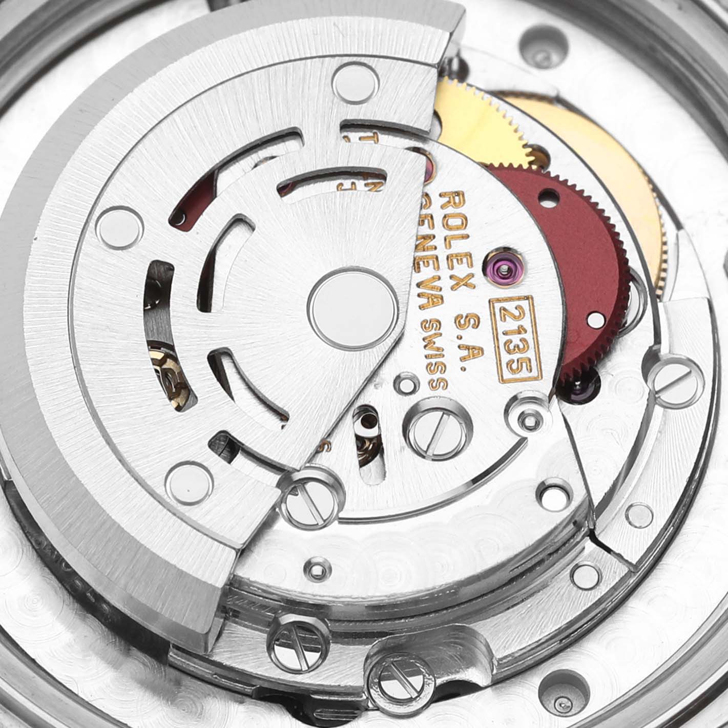 The image shows a close-up view of the movement mechanism of a Rolex Mid-Size 68273 Women
s Steel and Gold (two tone) Mother of Pearl Dial 68273 Women
s Steel and Gold (two tone) Mother of Pearl Dial model, highlighting the gears and the rotor.