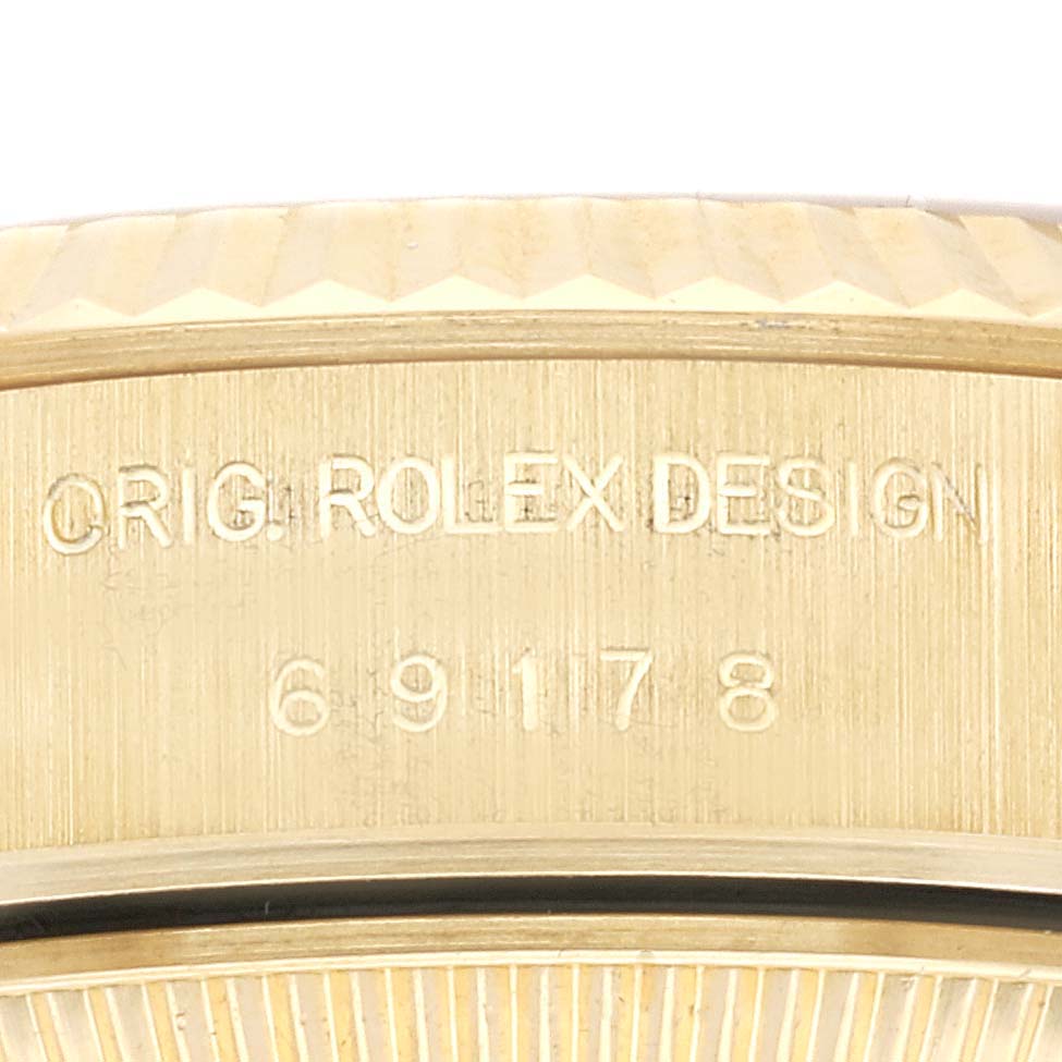 This close-up image shows the engraved model number and design markings on the case side of a Rolex President 69178 Women's Yellow Gold Champagne Dial 69178 Women's Yellow Gold Champagne Dial watch.
