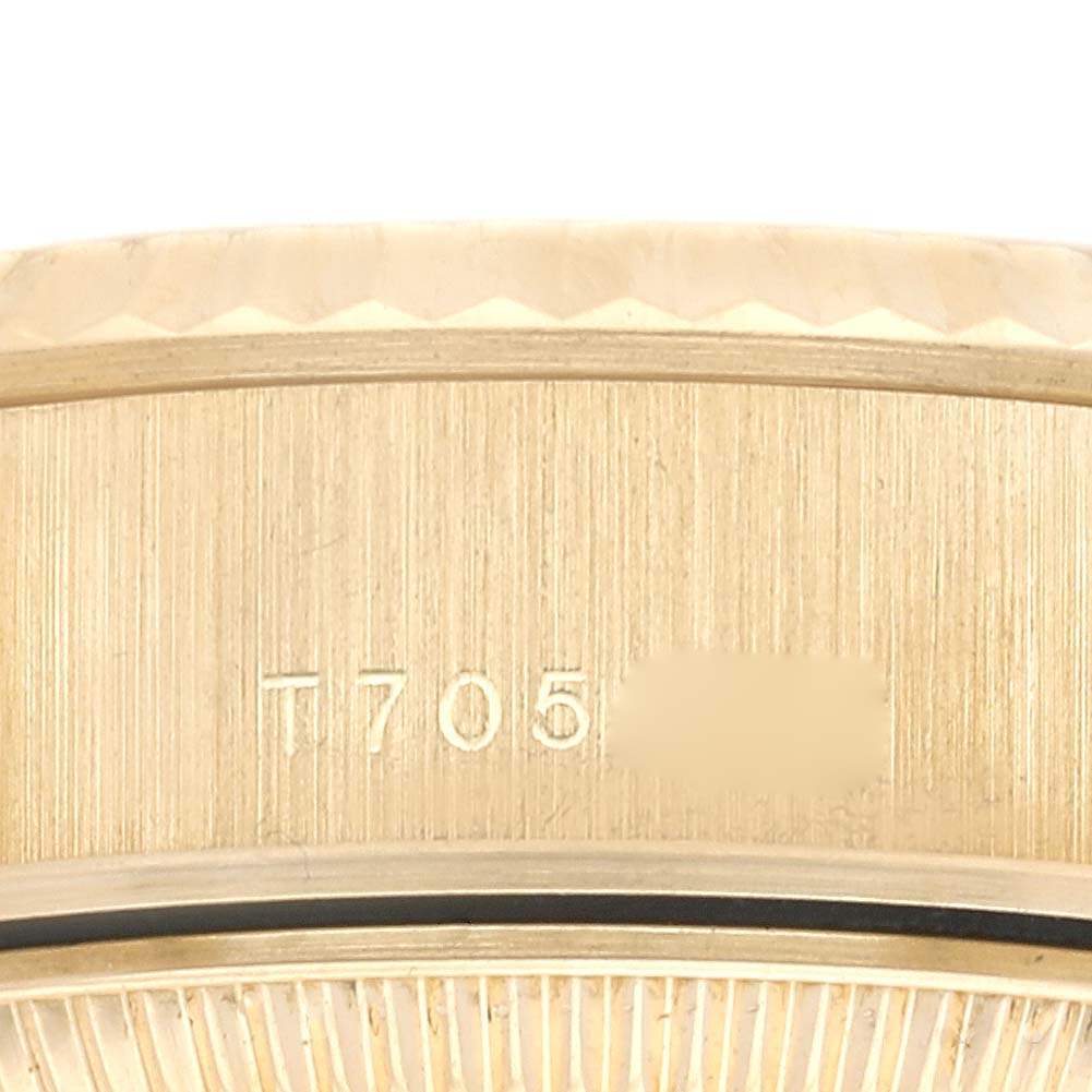 This image shows a close-up view of the serial number engraved on the side of a Rolex President 69178 Women's Yellow Gold Champagne Dial 69178 Women's Yellow Gold Champagne Dial model watch.