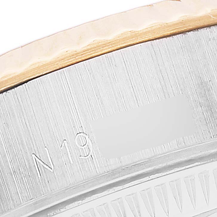 This close-up image shows the engraved bezel and case-back edge of a Rolex Datejust 69173 Women's Steel and Gold (two tone) Silver Dial 69173 Women's Steel and Gold (two tone) Silver Dial watch.