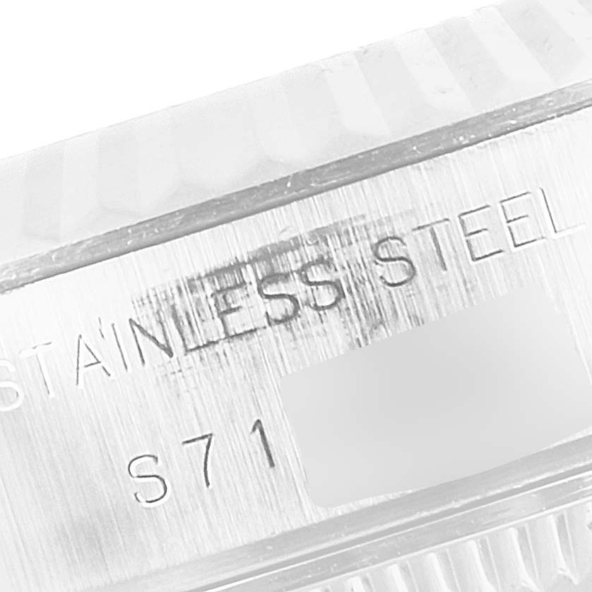 The image shows a close-up of the stainless steel part of the bezel or caseback of a Rolex Datejust 69174 Women's Stainless Steel Silver Dial 69174 Women's Stainless Steel Silver Dial watch.