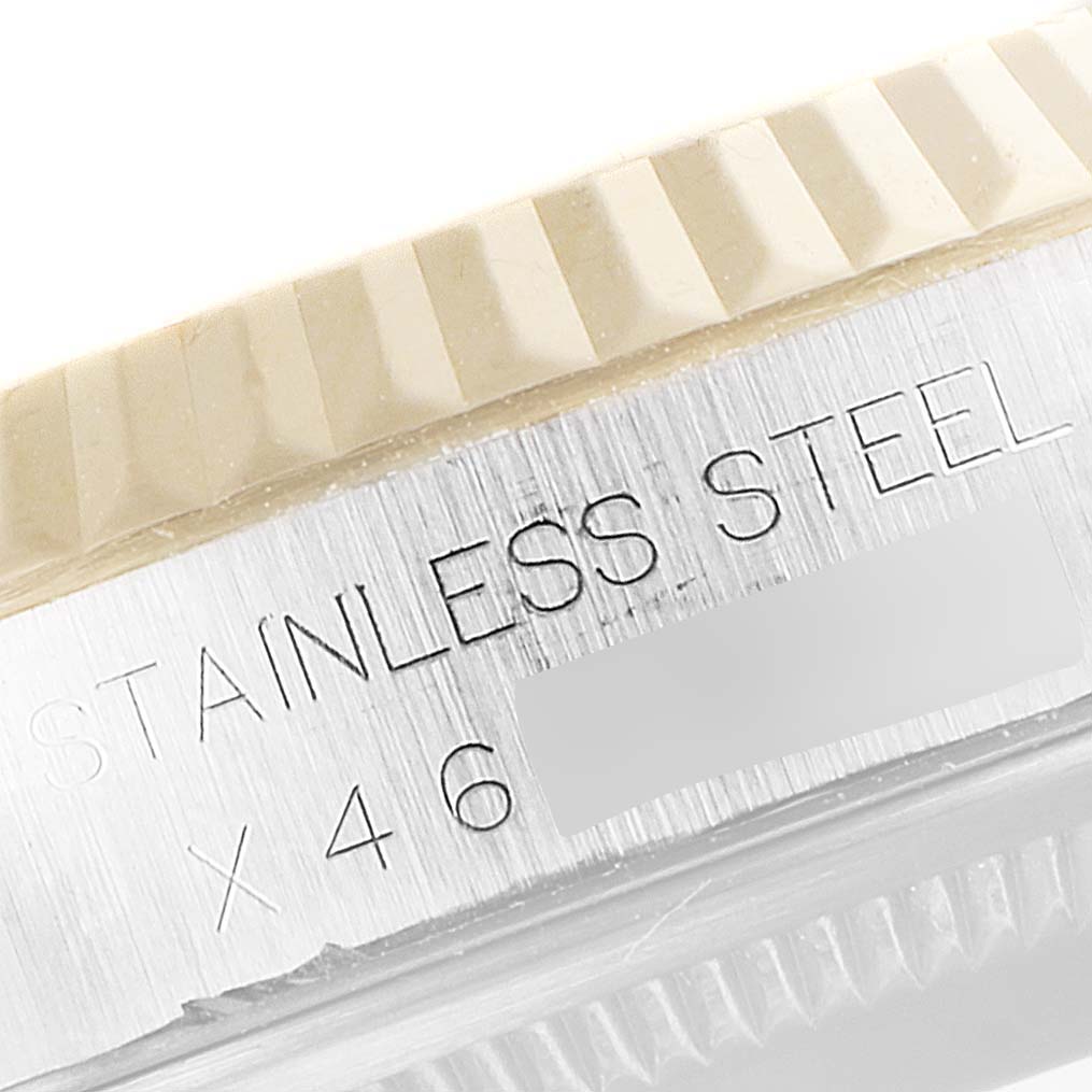 The image shows a close-up of the stainless steel case and part of the bezel of a Rolex Datejust 16233 Men's Steel and Gold (two tone) Blue Dial 16233 Men's Steel and Gold (two tone) Blue Dial watch.