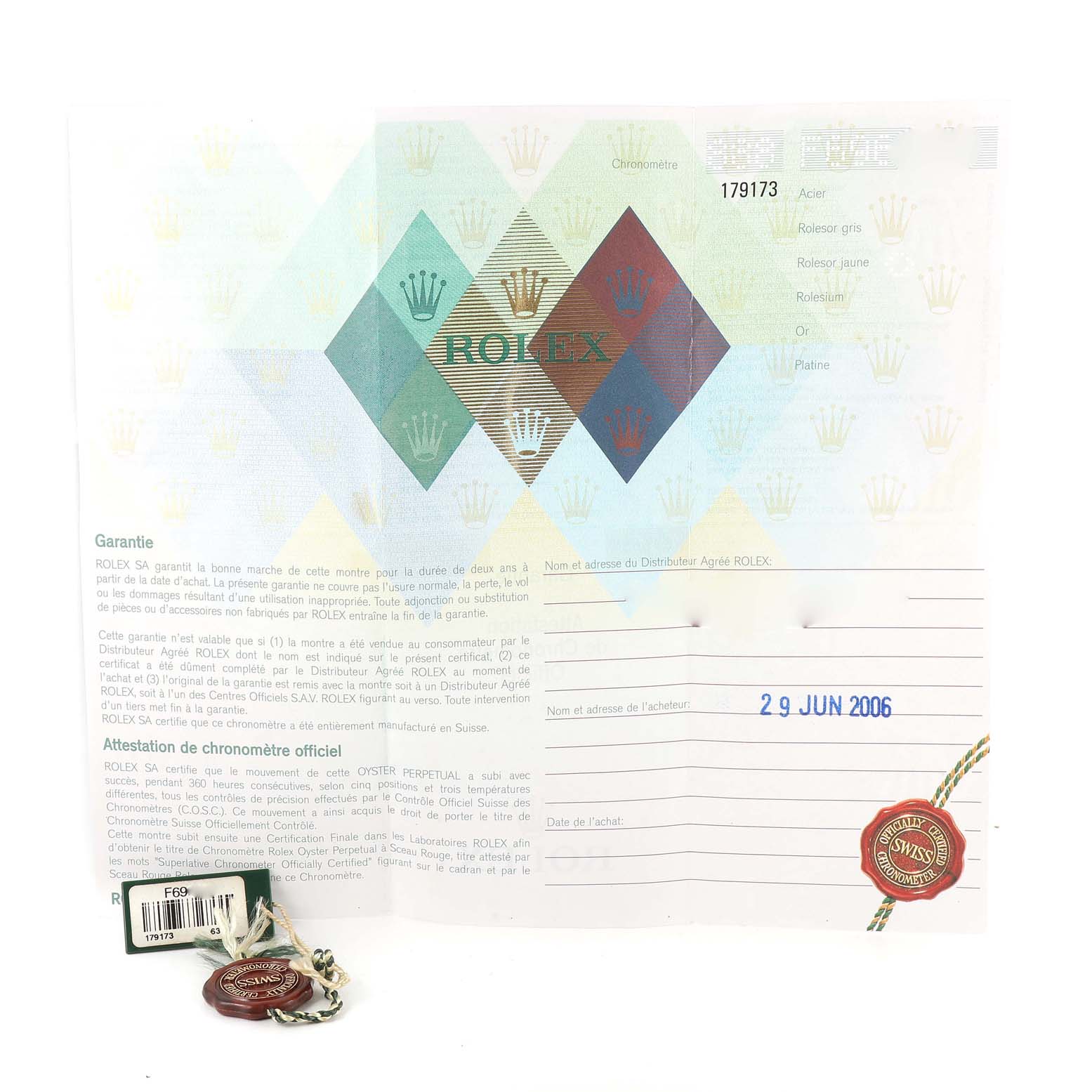 The image shows the warranty paperwork and tags for a Rolex Datejust 179173 Women's Steel and Gold (two tone) Champagne Dial 179173 Women's Steel and Gold (two tone) Champagne Dial model, dated June 29, 2006.