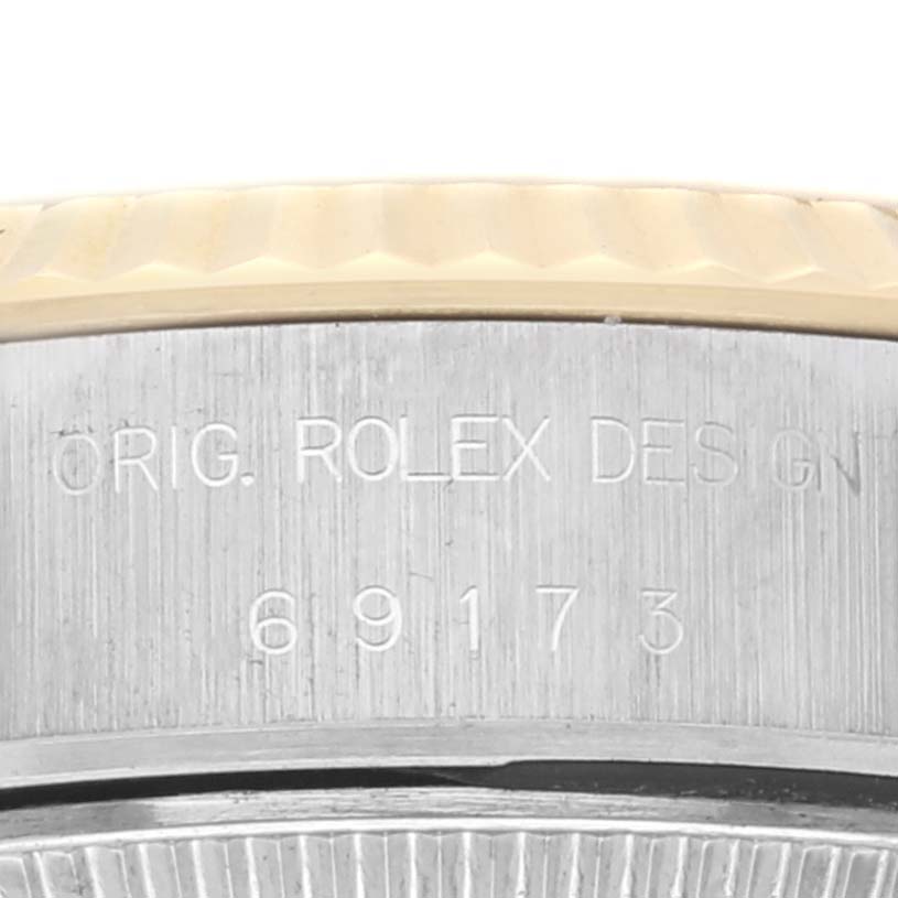 This image shows a close-up of the case side of a Rolex Datejust 69173 Women's Steel and Gold (two tone) Champagne Dial 69173 Women's Steel and Gold (two tone) Champagne Dial, highlighting the engraved model number and "Orig. Rolex Design."