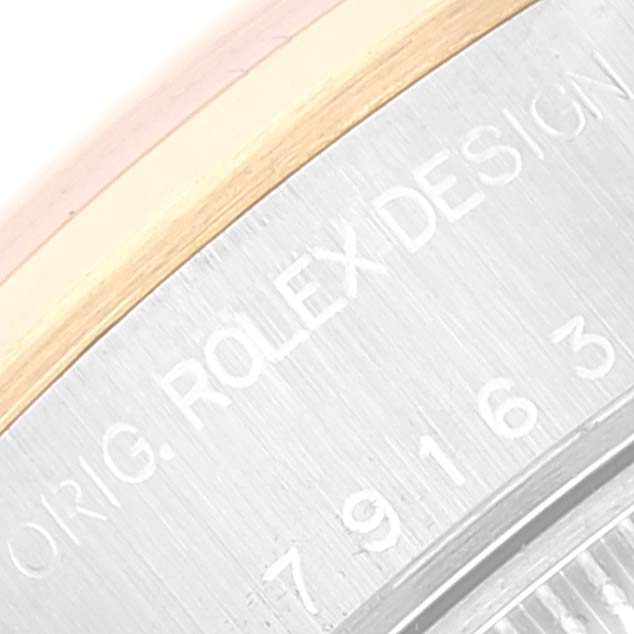 This image shows a close-up of the case back engraving on a Rolex Datejust 79163 Women's Steel and Gold (two tone) Mother of Pearl Dial 79163 Women's Steel and Gold (two tone) Mother of Pearl Dial watch.