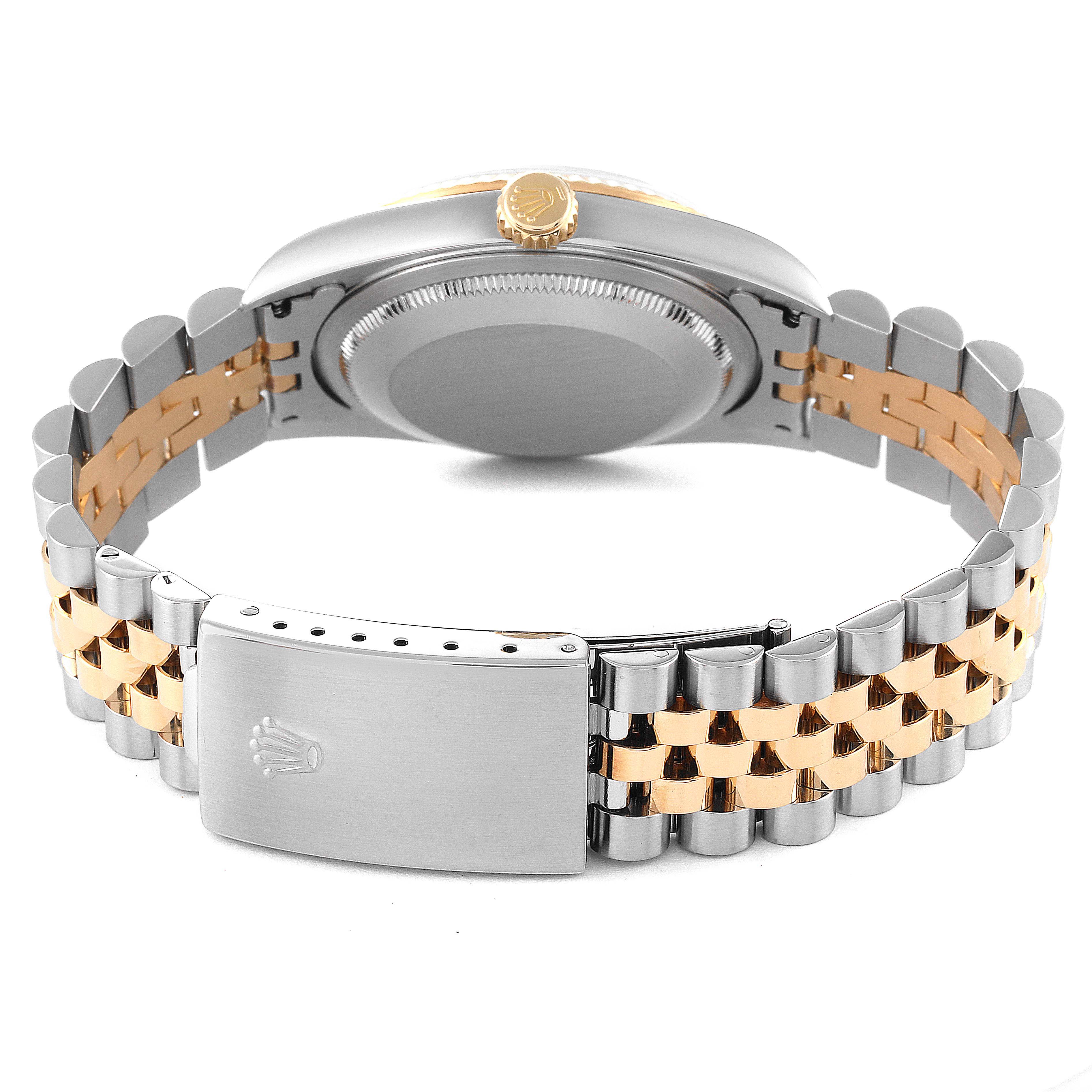 The image shows the back of a Rolex Datejust 16233 Men's Steel and Gold (two tone) White Dial 16233 Men's Steel and Gold (two tone) White Dial watch, focusing on its clasp, bracelet, and case back.