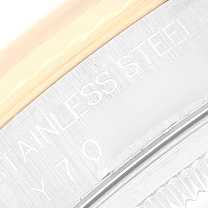 Close-up of the stainless steel case back and engraved text on a Rolex Datejust 16233 Men's Steel and Gold (two tone) White Dial 16233 Men's Steel and Gold (two tone) White Dial watch.