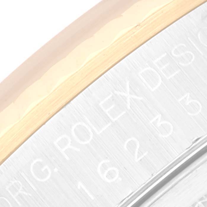 The image shows a close-up angle of the bezel and part of the casing, revealing the Rolex branding on the Datejust model.