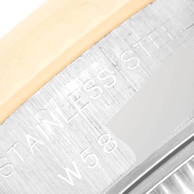 This image shows a close-up angle of the side of a Rolex Datejust 69173 Women's Steel and Gold (two tone) White Dial 69173 Women's Steel and Gold (two tone) White Dial watch, focusing on the engraved stainless steel text.