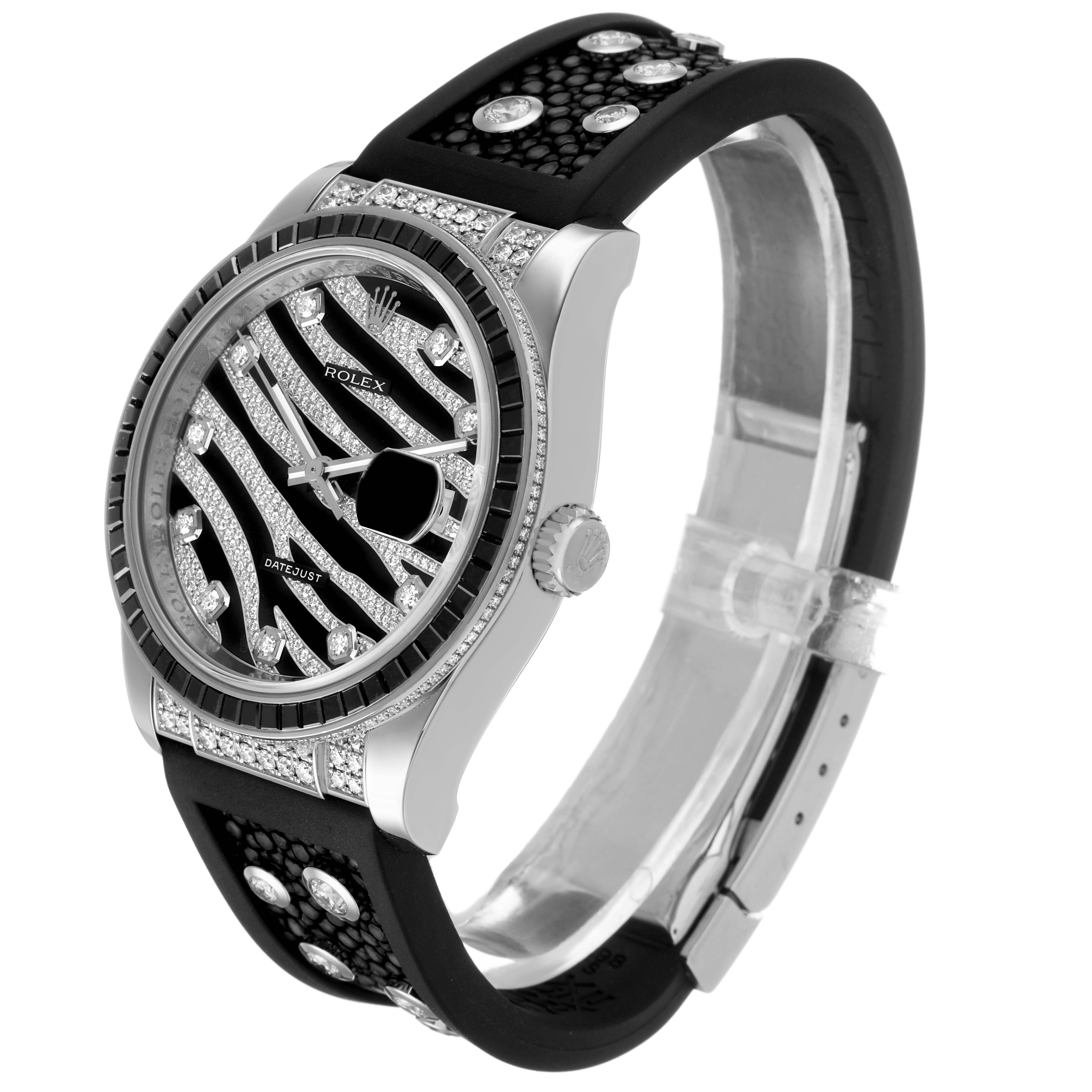 The Rolex Datejust 116199 SANR Women's White Gold Black Dial watch is shown at a side angle, highlighting the bezel, dial, strap, and crown.