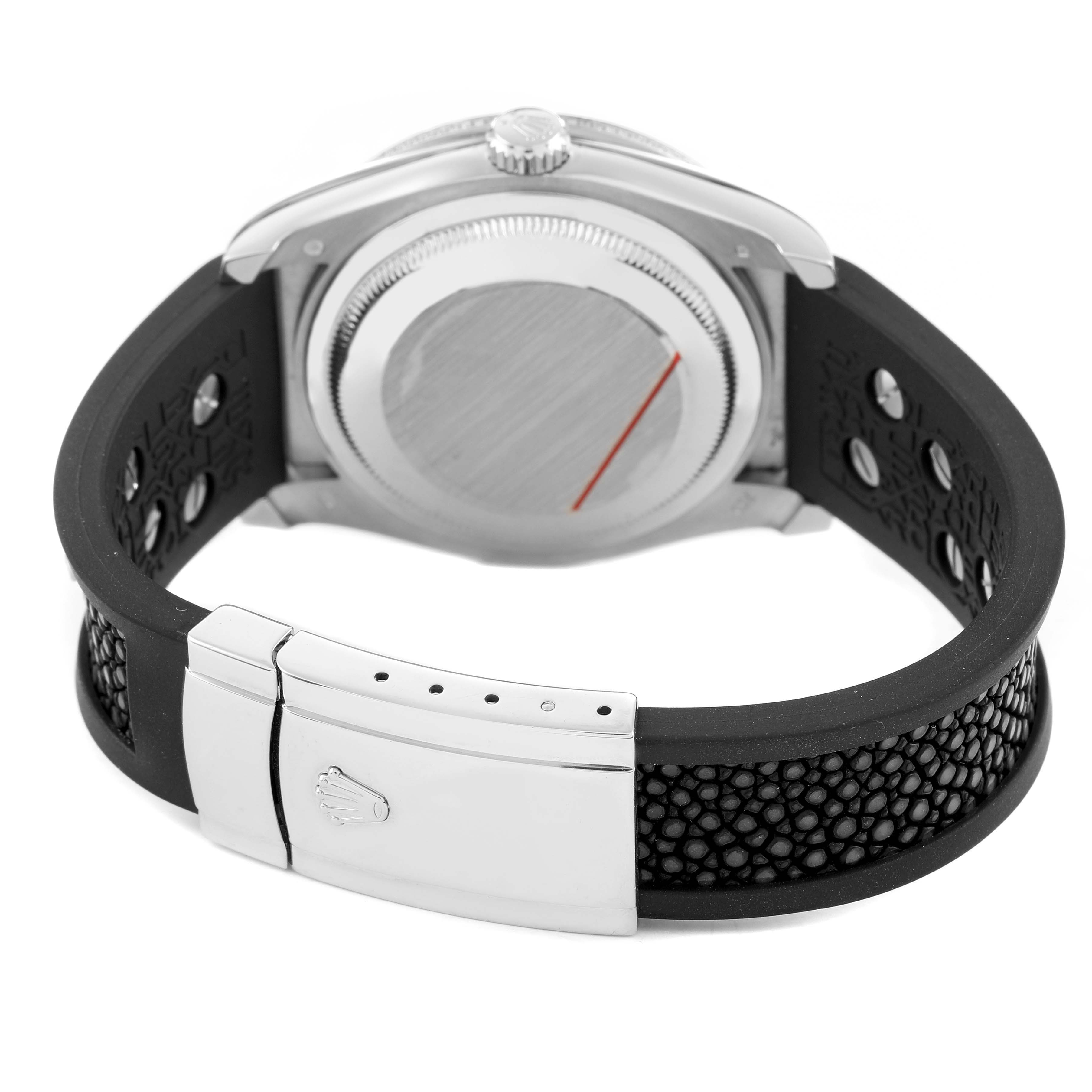 This image shows the back of a Rolex Datejust 116199 SANR Women's White Gold Black Dial, highlighting the case, crown, and closed clasp with a textured strap.