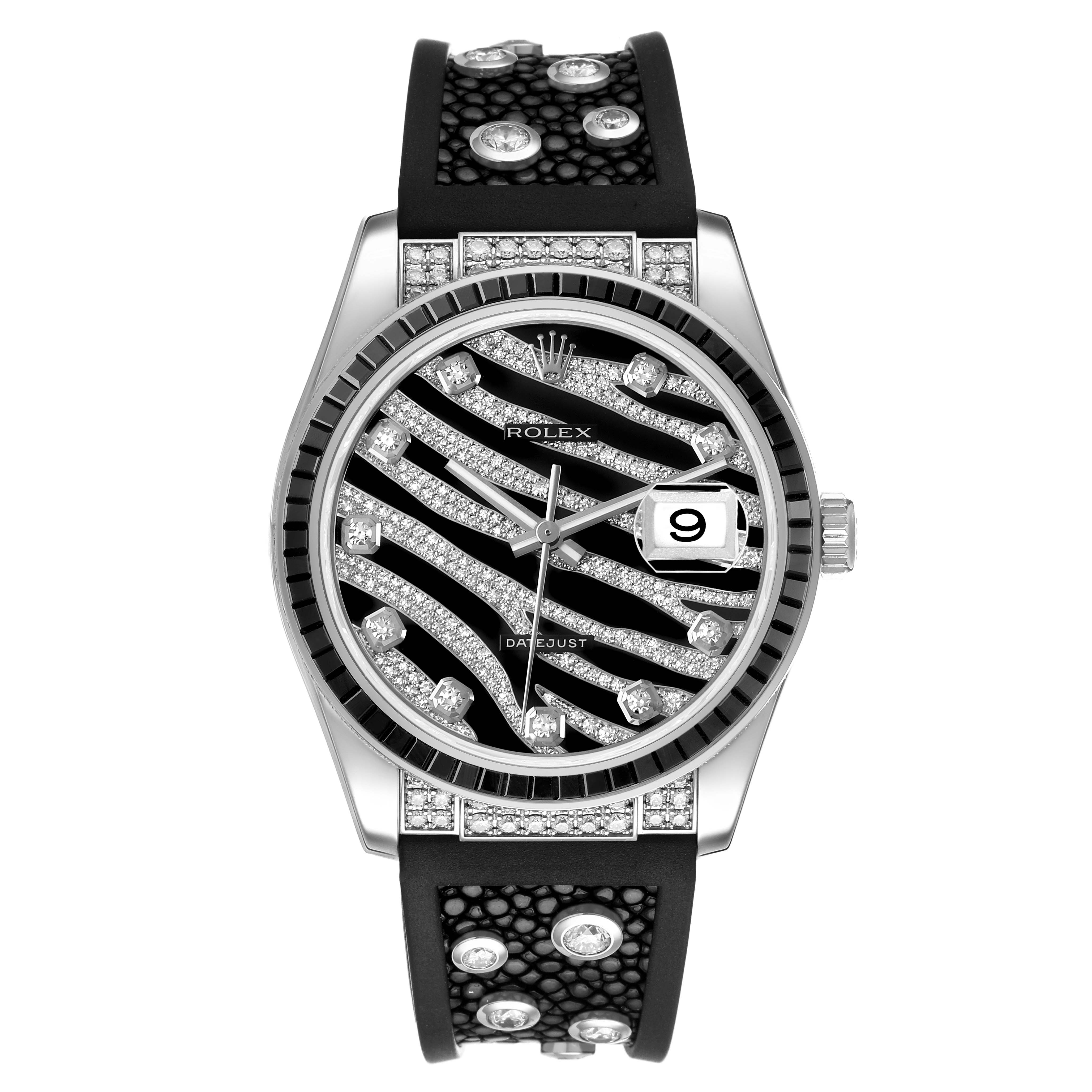 The Rolex Datejust 116199 SANR Women's White Gold Black Dial watch is shown from the front, highlighting its patterned dial, bezel, and strap with decorative stones.
