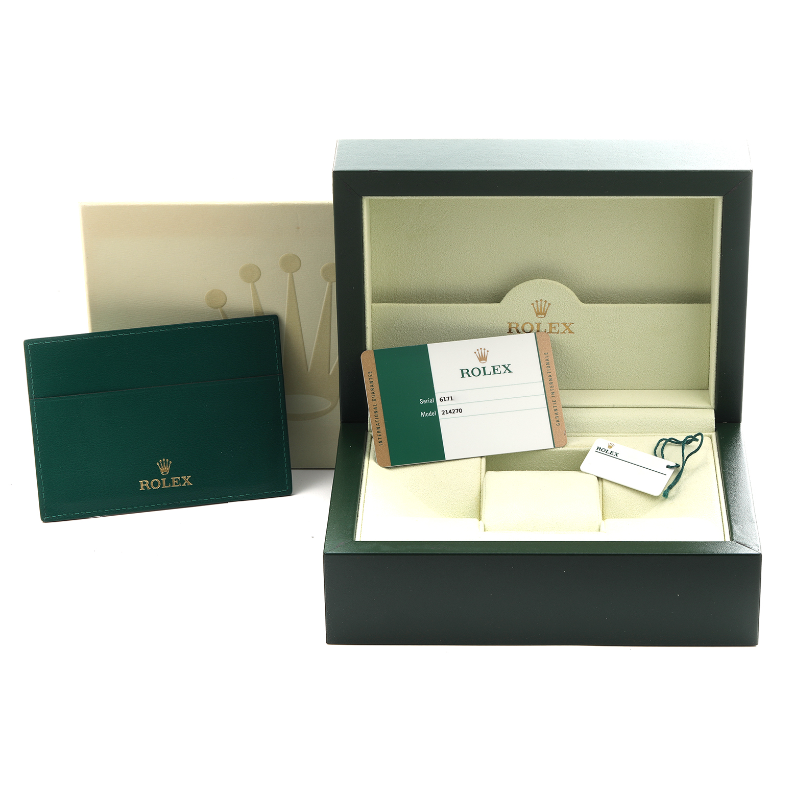 The image shows the accessories of a Rolex Explorer 214270 Men
s Stainless Steel Black Dial 214270 Men
s Stainless Steel Black Dial watch, including the box, warranty card, and tag, viewed from the front.