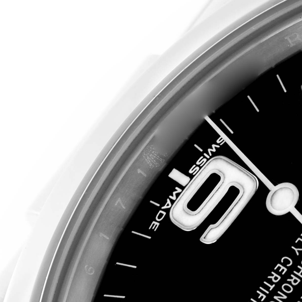 The image shows a close-up of the dial on a Rolex Explorer 214270 Men
s Stainless Steel Black Dial 214270 Men
s Stainless Steel Black Dial, highlighting the watch
s date window and part of the bezel.