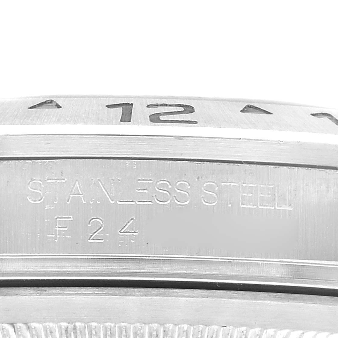 This image shows a close-up of the stainless steel bezel and engraved markings of a Rolex Explorer 16570T Men's Stainless Steel Black Dial 16570T Men's Stainless Steel Black Dial watch.