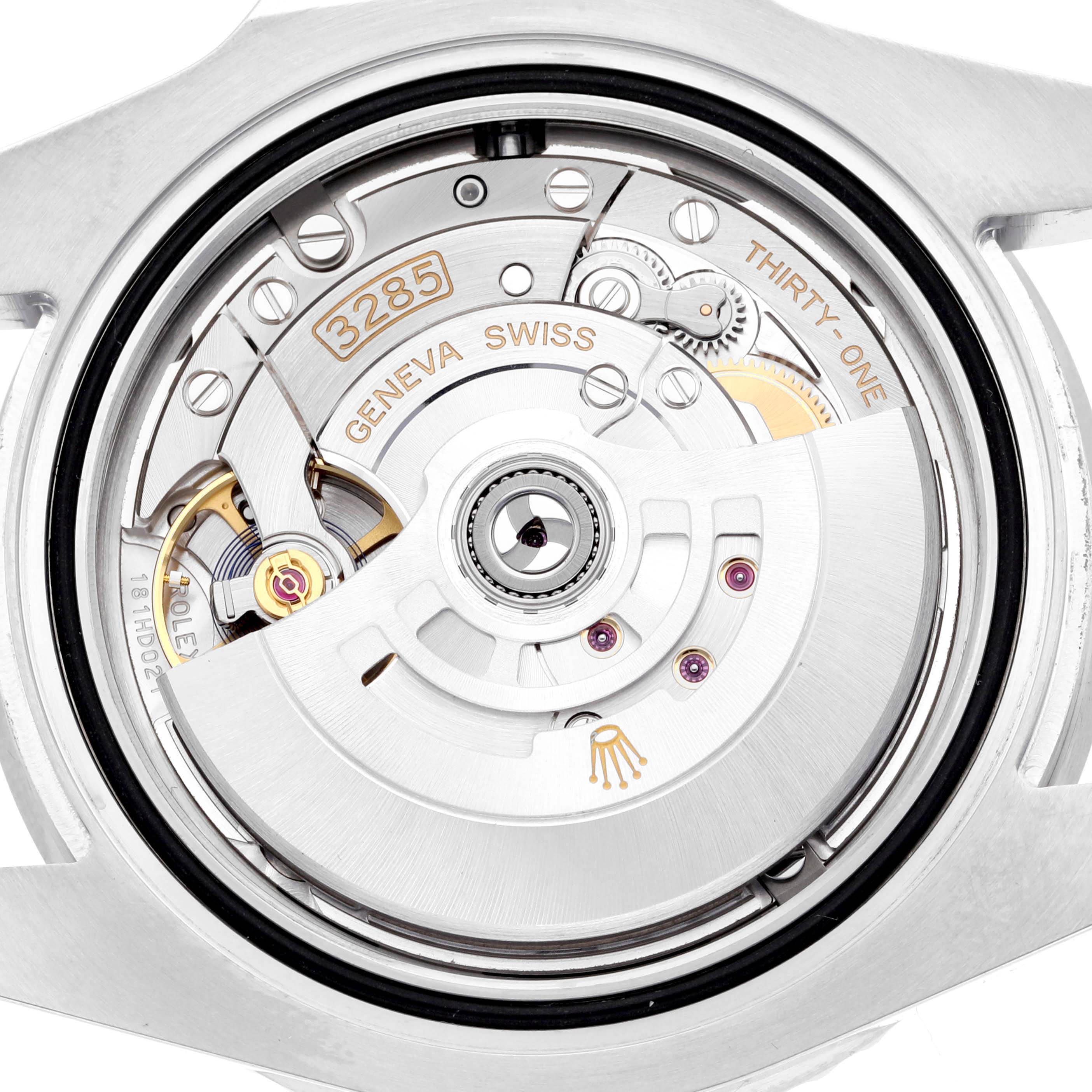 The image shows a close-up of the movement of a Rolex GMT-Master 126710BLNR Men
s Stainless Steel Black Dial 126710BLNR Men
s Stainless Steel Black Dial watch, highlighting its intricate internal mechanisms.