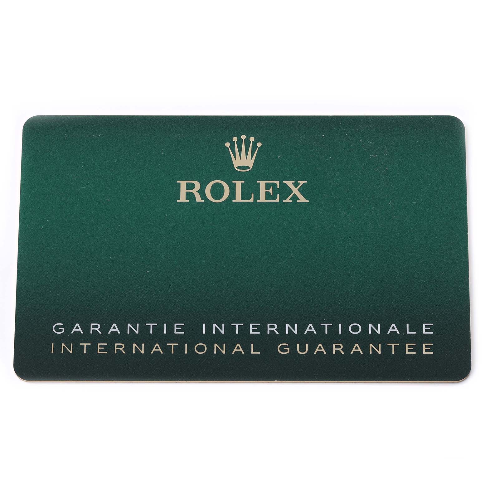 The image shows a Rolex international guarantee card, not the Rolex GMT-Master 126710BLNR Men
s Stainless Steel Black Dial 126710BLNR Men
s Stainless Steel Black Dial watch itself.