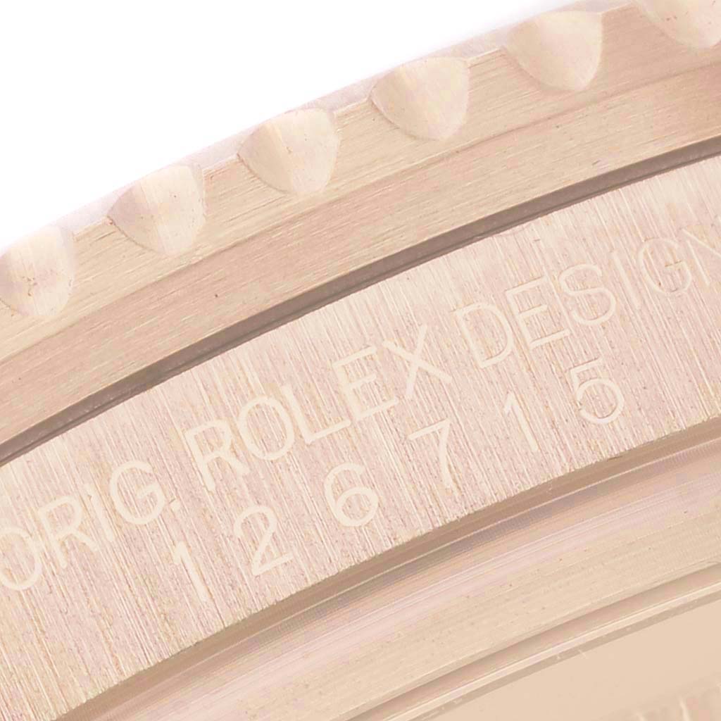 The image shows a close-up of the bezel edge and engraved side of a Rolex GMT-Master 126715CHNR Men's Rose Gold Black Dial watch, displaying part of its model number.