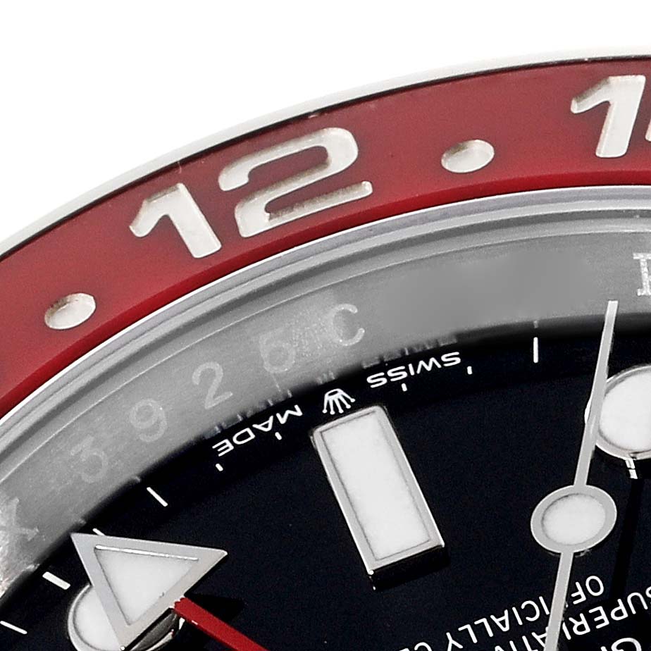 The close-up image shows the bezel, part of the dial, and the GMT hand of a Rolex GMT-Master 126710 Men
s Stainless Steel Black Dial 126710 Men
s Stainless Steel Black Dial watch from an oblique angle.