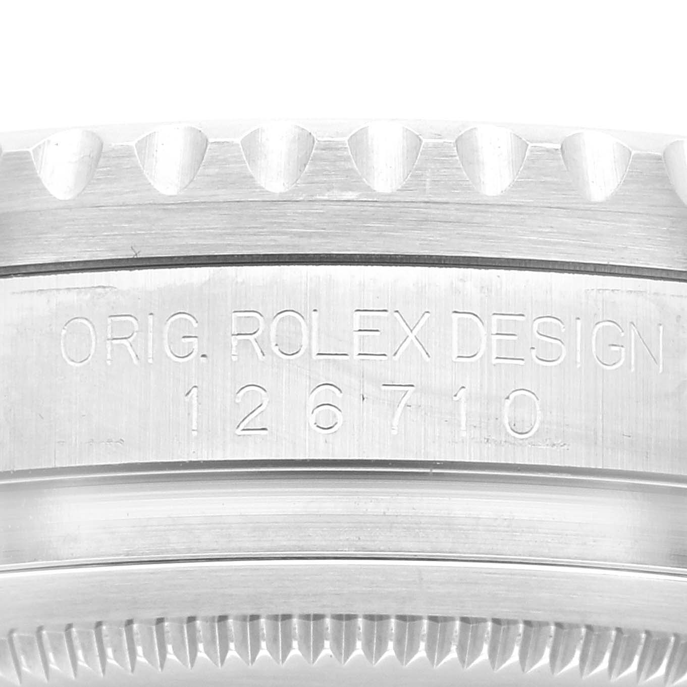 The image shows a close-up of the case back of a Rolex GMT-Master 126710 Men
s Stainless Steel Black Dial 126710 Men
s Stainless Steel Black Dial, specifically focusing on the model number engraving.
