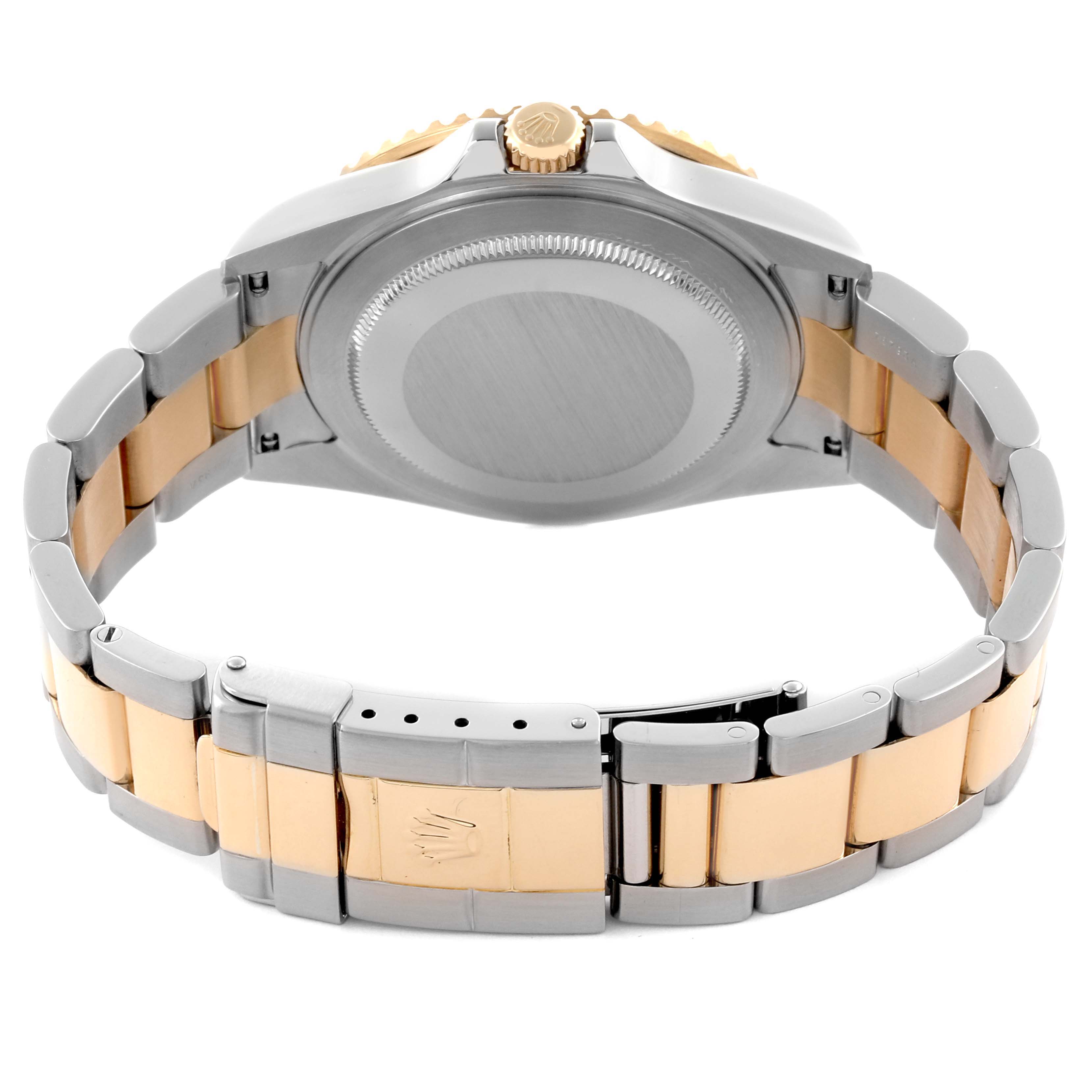 The image shows the back and clasp of the Rolex GMT-Master 16713 Men
s Steel and Gold (two tone) Black Dial 16713 Men
s Steel and Gold (two tone) Black Dial watch, highlighting its two-tone bracelet.