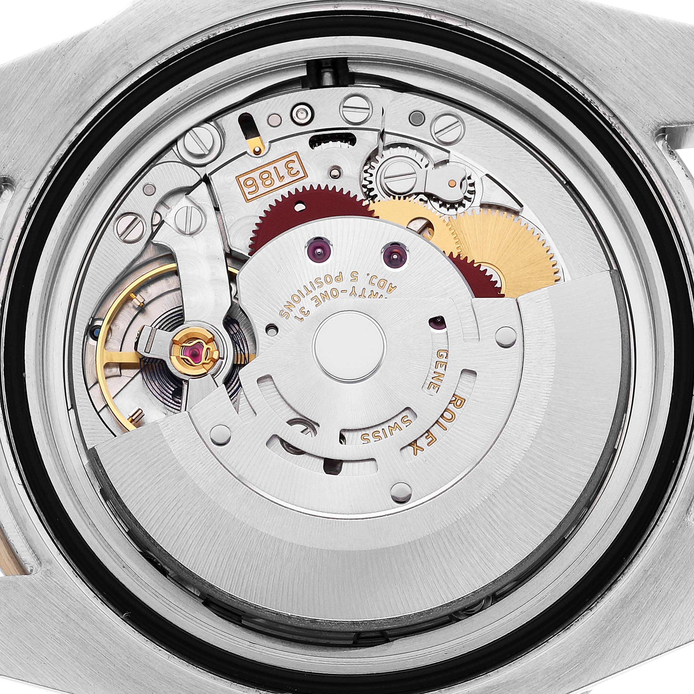 This image shows a close-up view of the movement mechanism inside a Rolex GMT-Master 116713 Men's Steel and Gold (two tone) Black Dial 116713 Men's Steel and Gold (two tone) Black Dial watch.