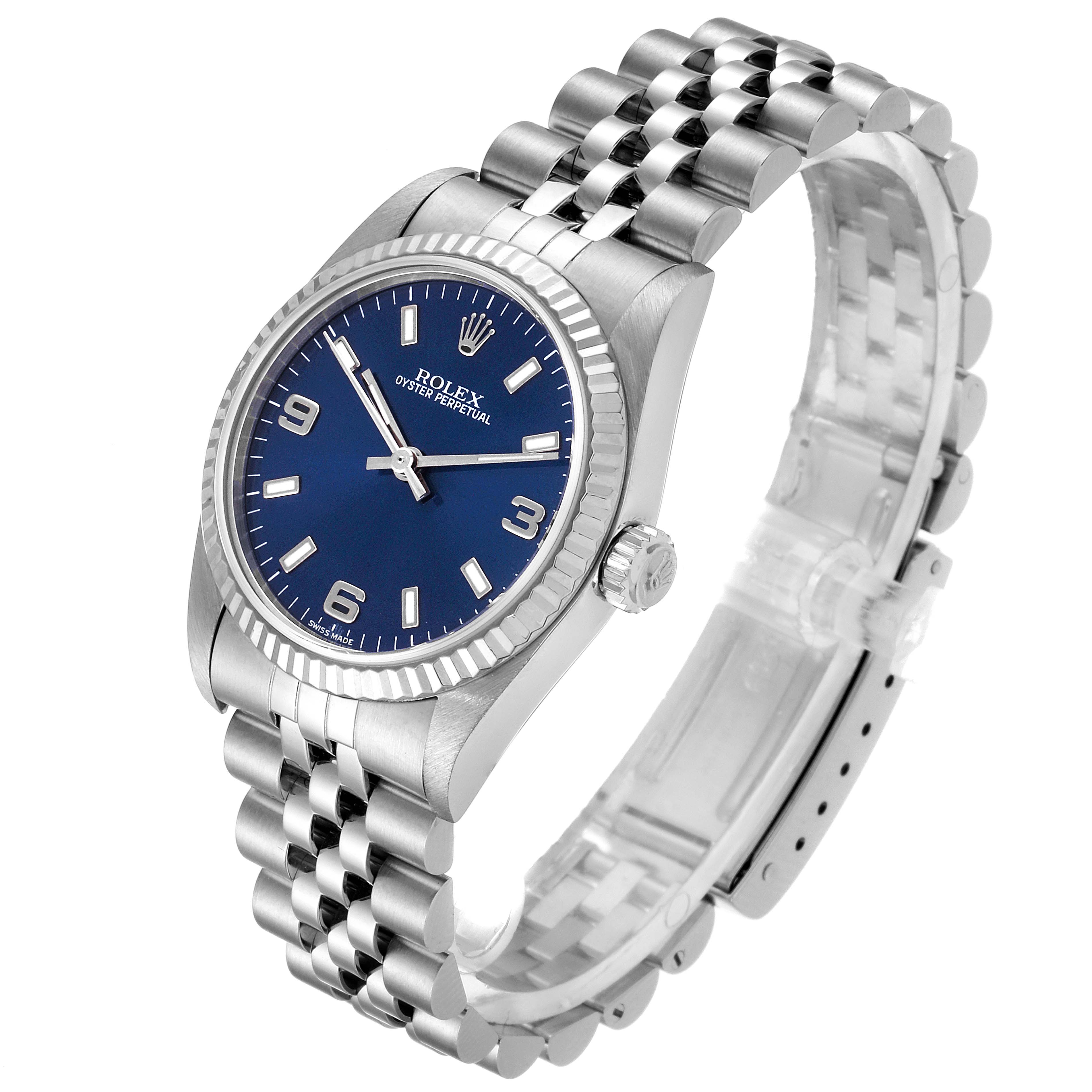 The image shows a mid-size Rolex Oyster Perpetual watch with a blue dial and Jubilee bracelet at a slight angle.