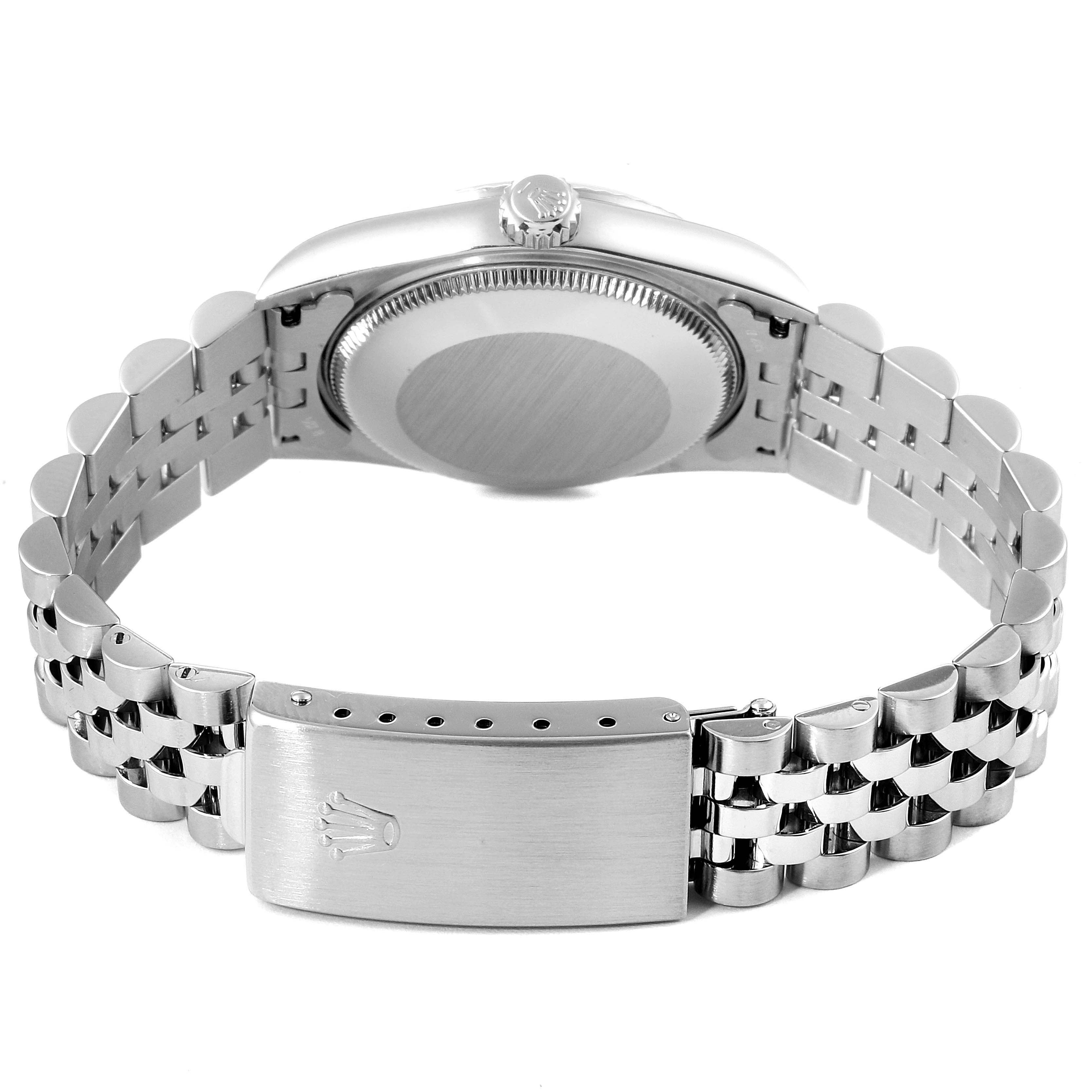 The image shows the back casing and the bracelet with clasp of a Mid-Size Rolex watch, viewed from the rear.