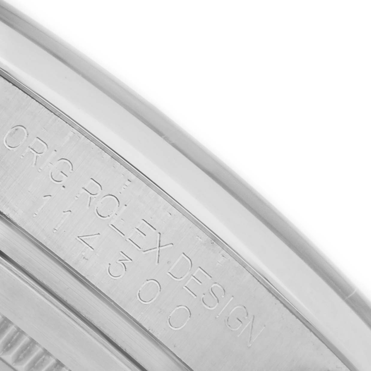 The image shows a close-up of the inner bezel with the serial number of a Rolex Oyster Perpetual 114300 Men
s Stainless Steel Red Dial 114300 Men
s Stainless Steel Red Dial watch.