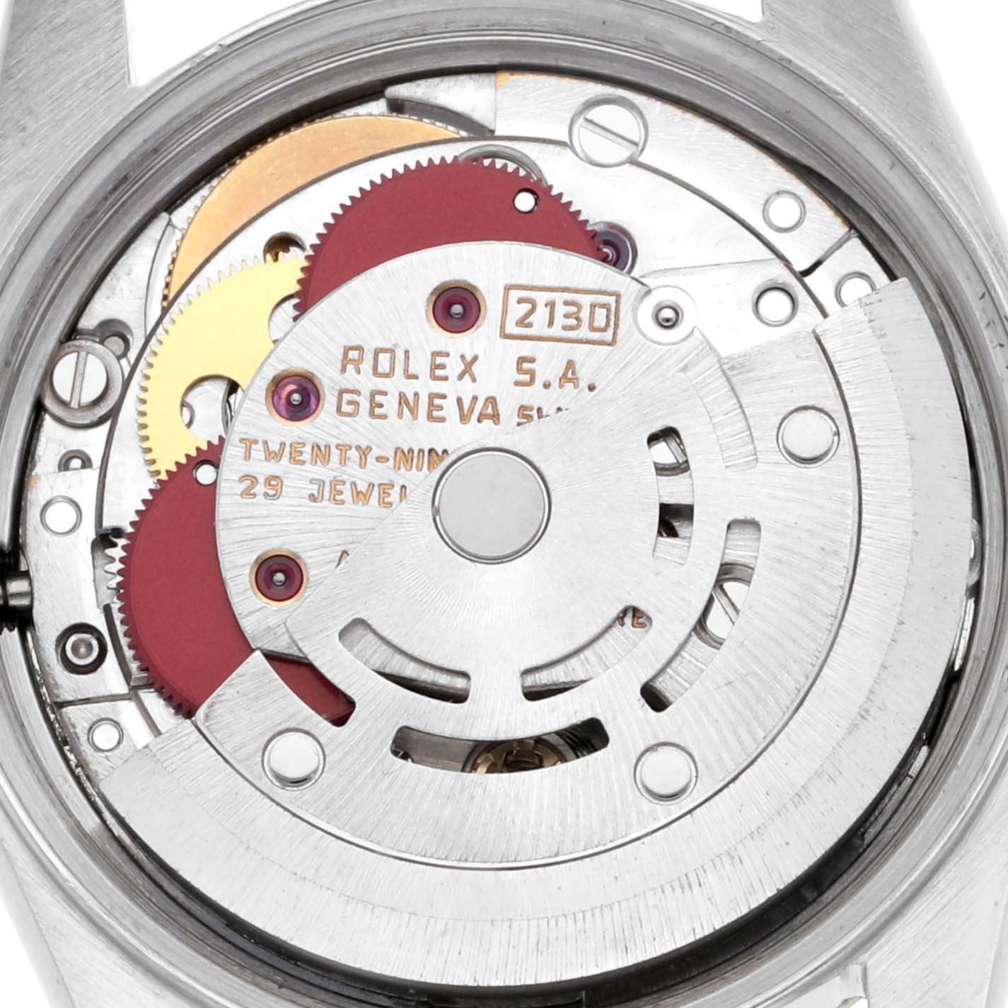 This image shows the movement of a Rolex Oyster Perpetual 67193 Women's Steel and Gold (two tone) Champagne Dial 67193 Women's Steel and Gold (two tone) Champagne Dial watch from a top-down angle, revealing gears and the rotor.