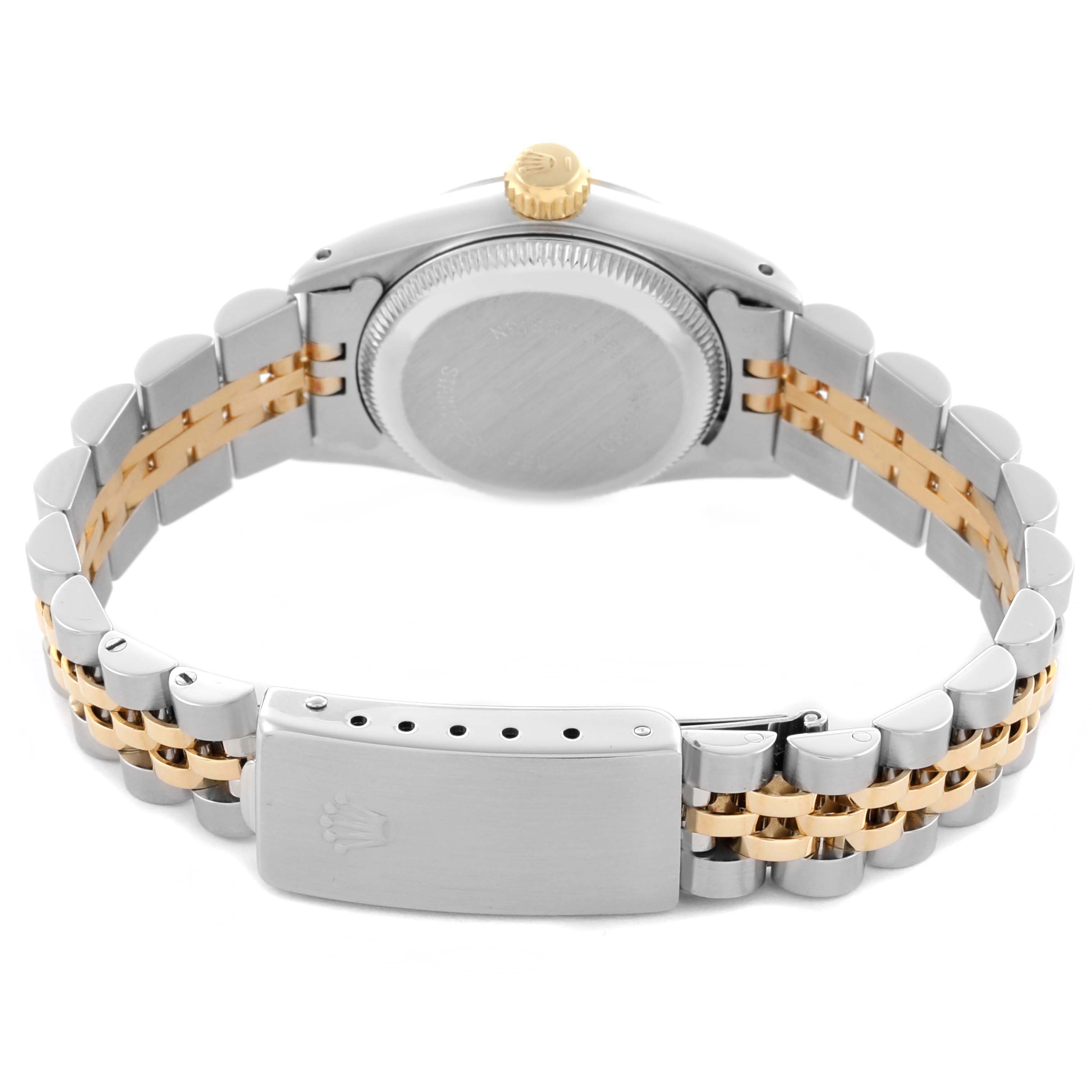 The image shows the back and clasp of a Rolex Oyster Perpetual 67193 Women's Steel and Gold (two tone) Champagne Dial 67193 Women's Steel and Gold (two tone) Champagne Dial watch, highlighting the bracelet and crown.